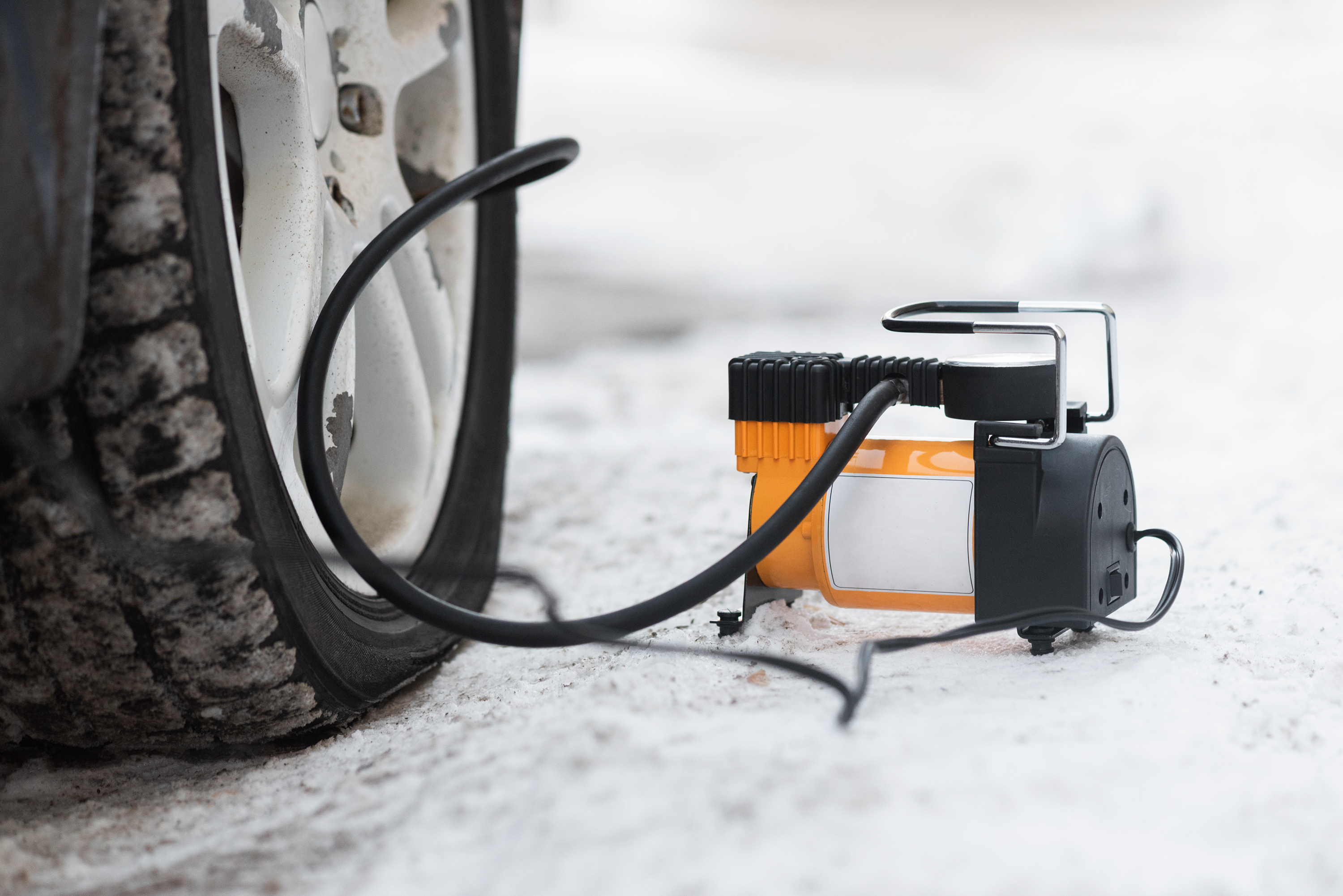 Car,Pump,And,Empty,Wheel,Close,Up.,Pumping,The,Car