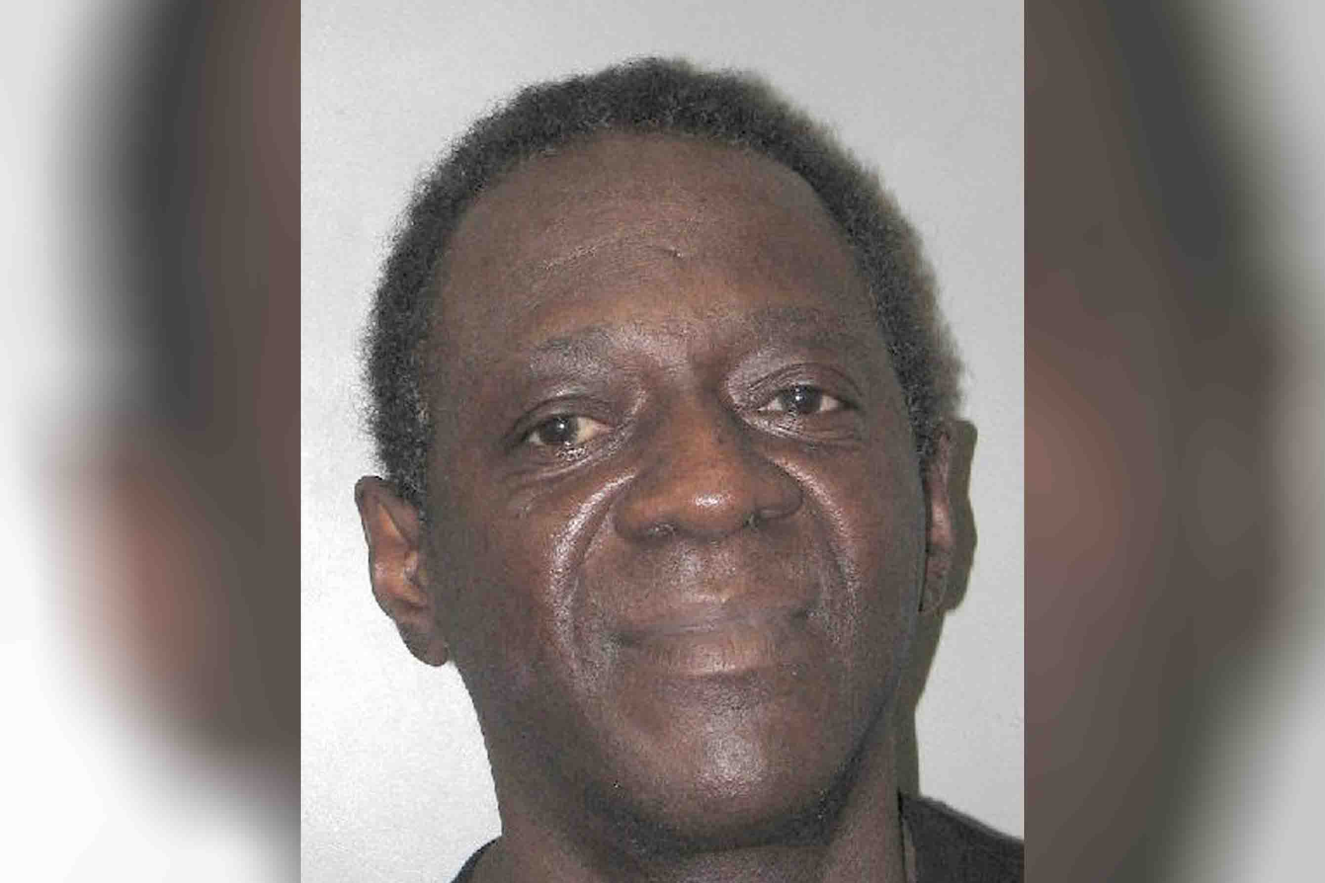 Flavor Flavs booking photo after domestic violence arrest