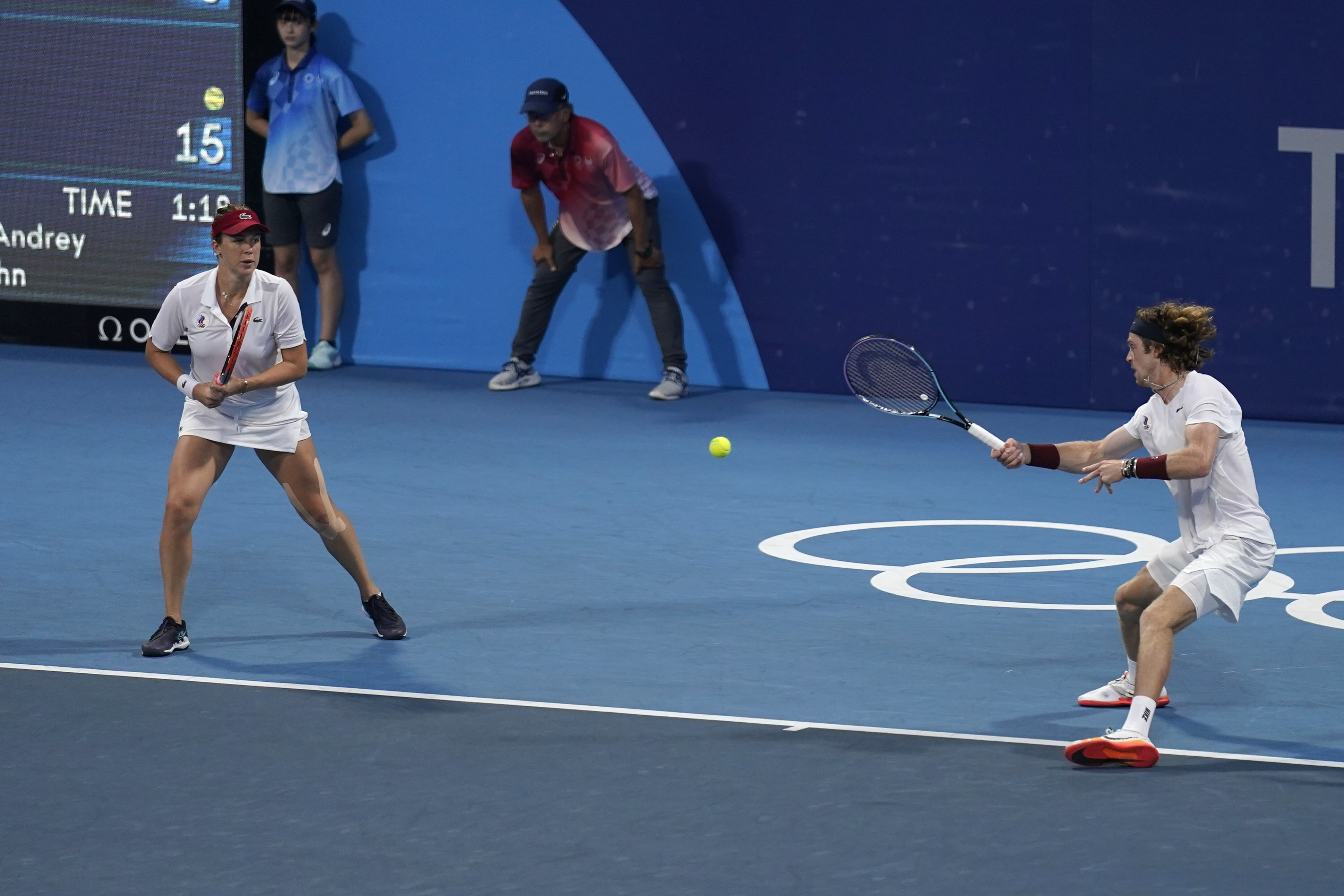 The Russian Olympic Committee mixed doubles team of Anastasia Pavlyuchenkova, left, and Andrey Rublev, play during a semifinals match of the tennis competition at the 2020 Summer Olympics, Friday, July 30, 2021, in Tokyo, Japan. (AP Photo/Seth Wenig)