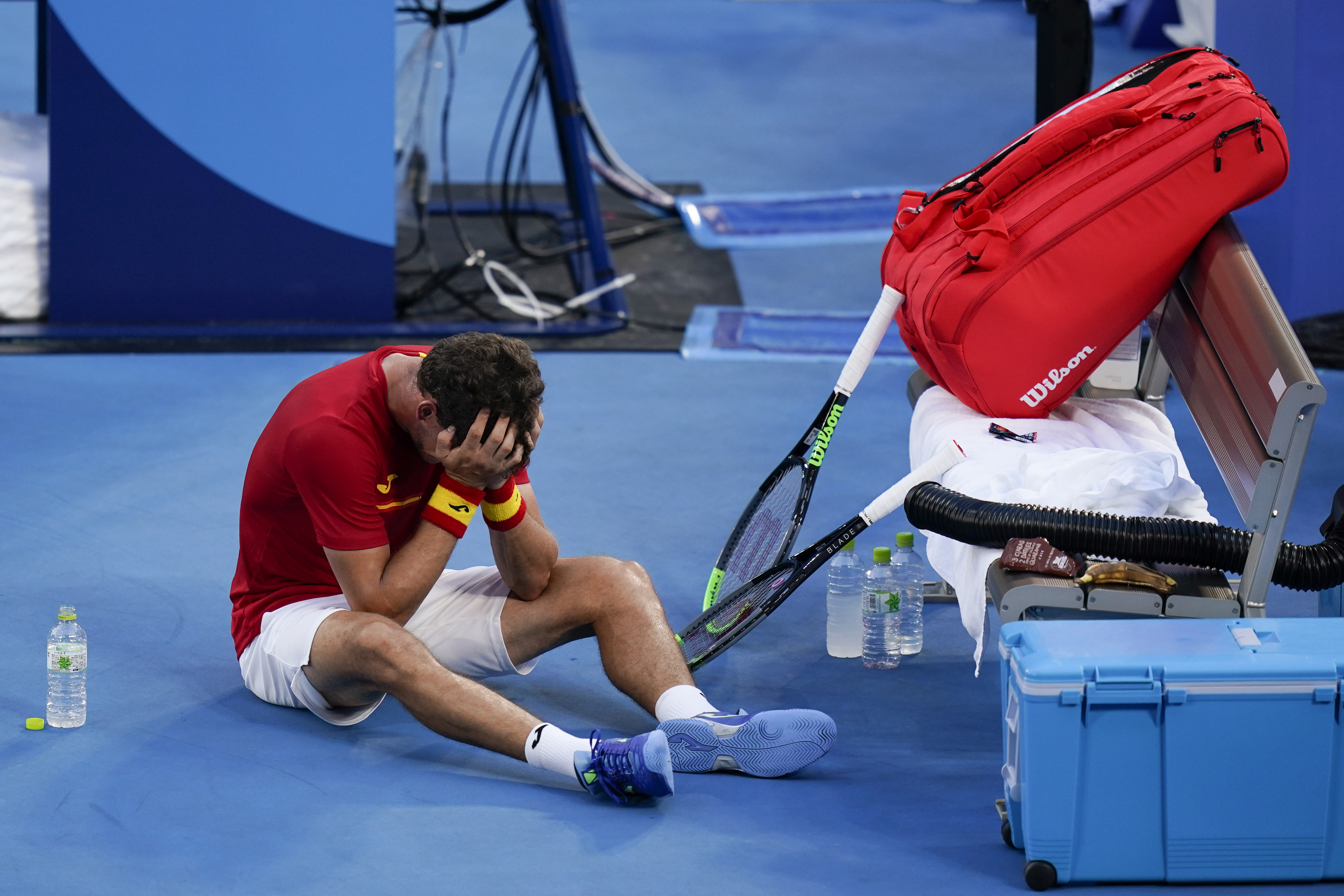 Pablo Carreno Busta, of Spain, reacts after defeating Novak Djokovic, of Serbia, in the bronze medal match of the tennis competition at the 2020 Summer Olympics, Saturday, July 31, 2021, in Tokyo, Japan. (AP Photo/Seth Wenig)