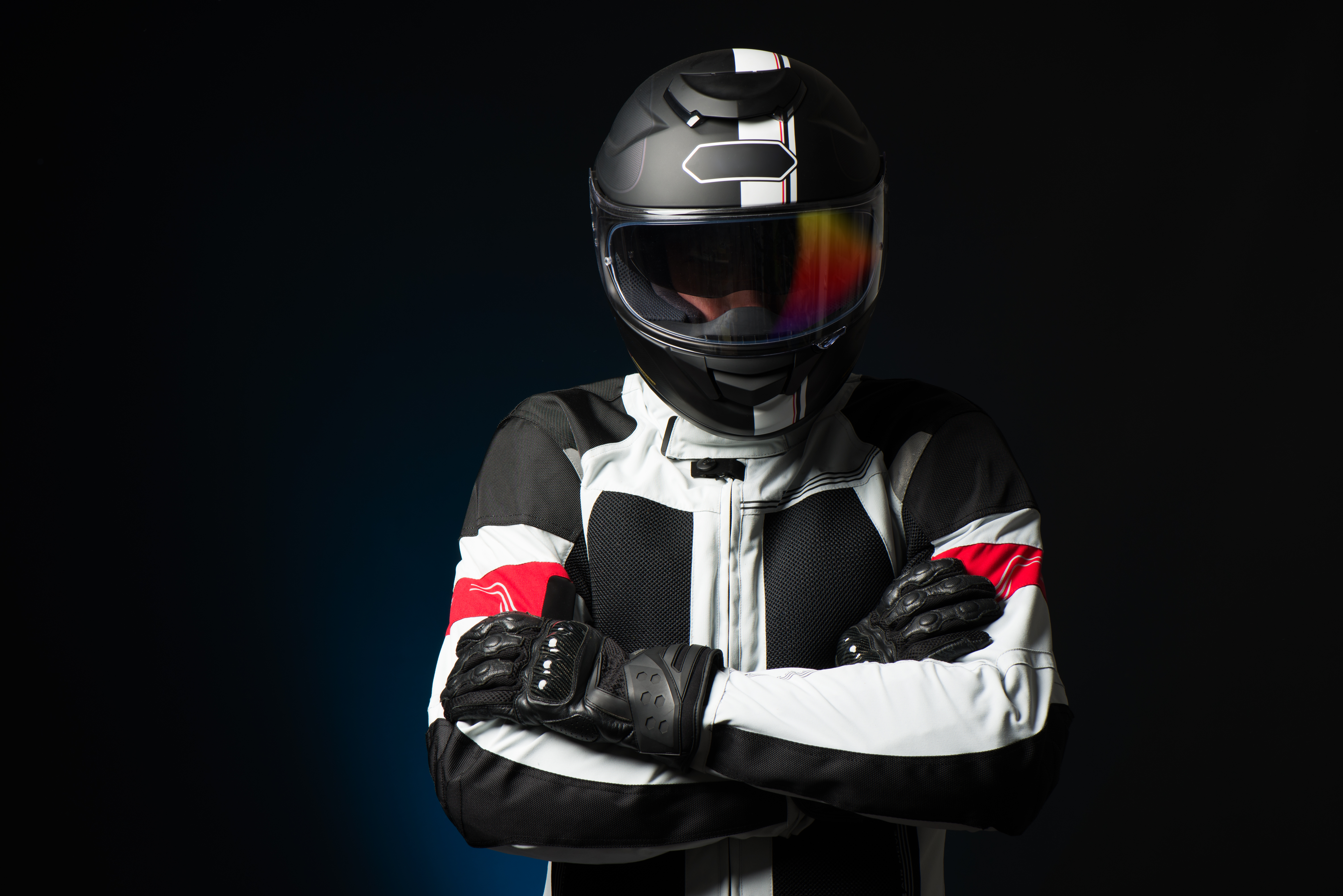 Biker,In,Protective,Suit,With,A,Helmet