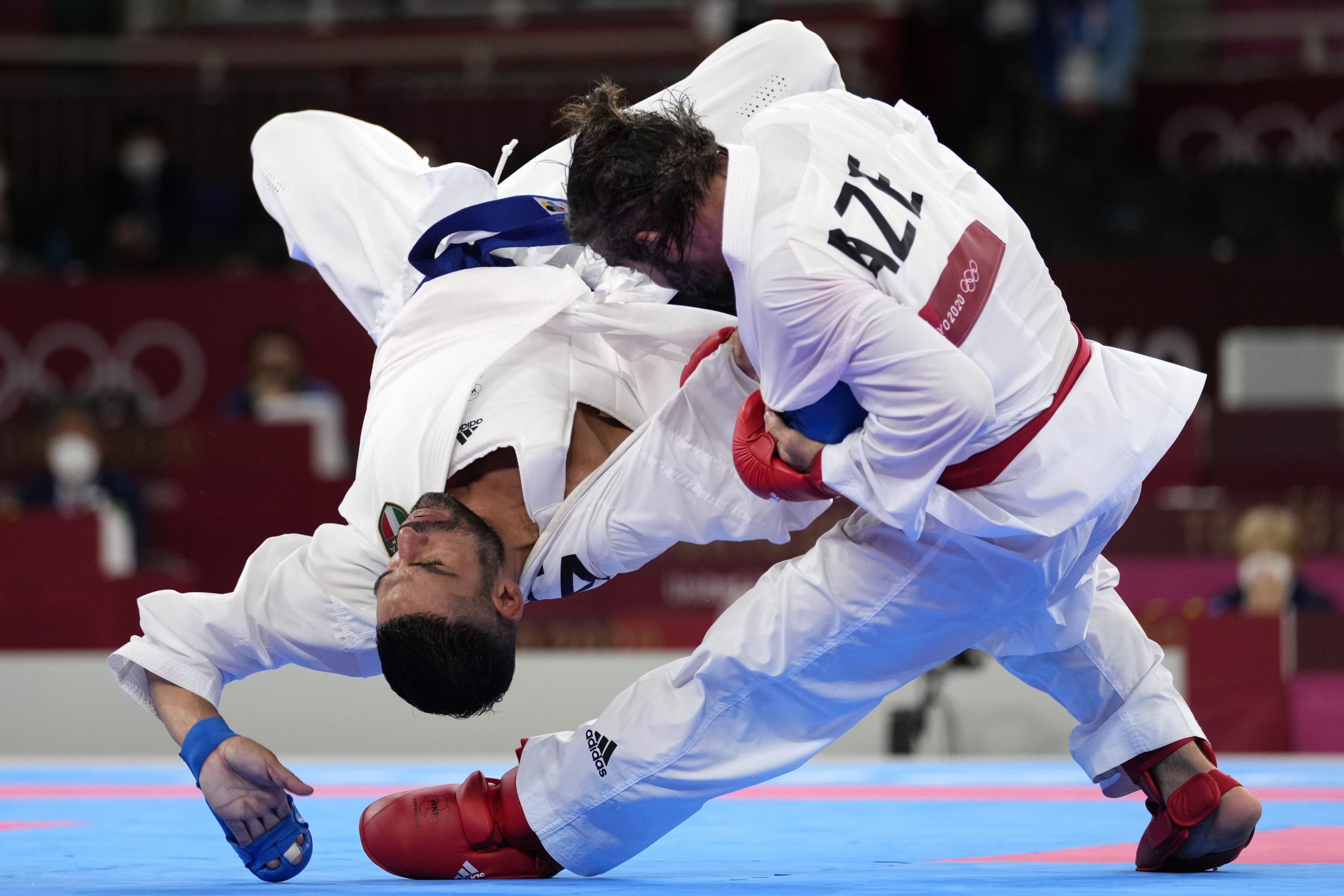 Luigi Busa of Italy, left, and Rafael Aghayev of Azerbaijan compete during their men's kumite -75kg gold medal bout for karate at the 2020 Summer Olympics, Friday, Aug. 6, 2021, in Tokyo, Japan. (AP Photo/Vincent Thian)