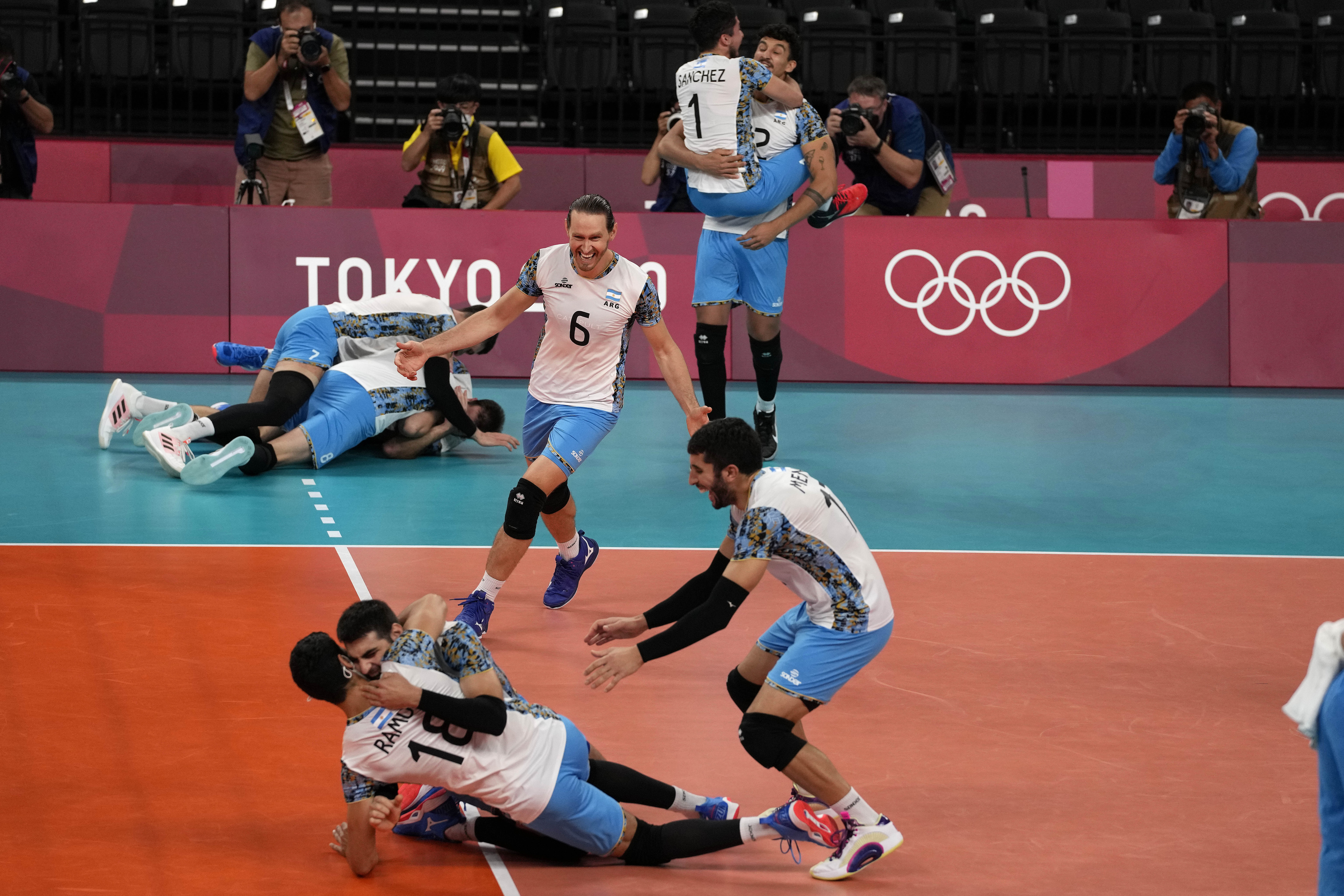 Argentinian players celebrate after winning the men's volleyball bronze medal match between Argentina and Brazil at the 2020 Summer Olympics, Saturday, Aug. 7, 2021, in Tokyo, Japan. (AP Photo/Frank Augstein)