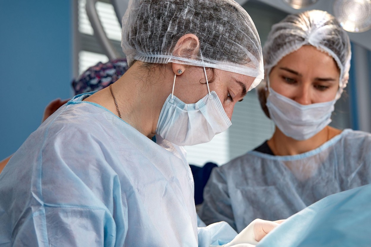 Concentrated Surgical team operating a patient in an operation theater.