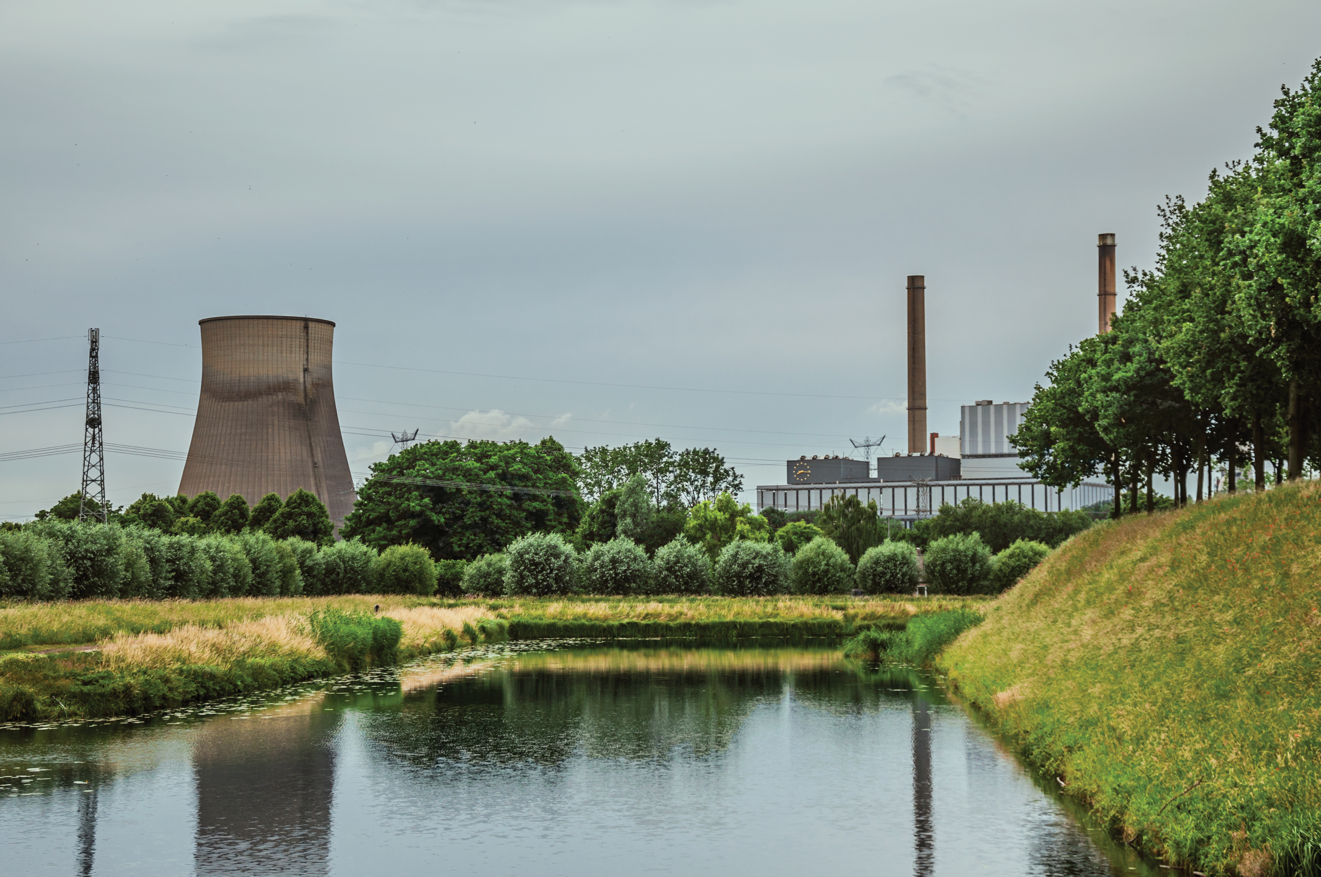 View,Of,Canal,And,Gardens,With,Nuclear,Power,Plant,In