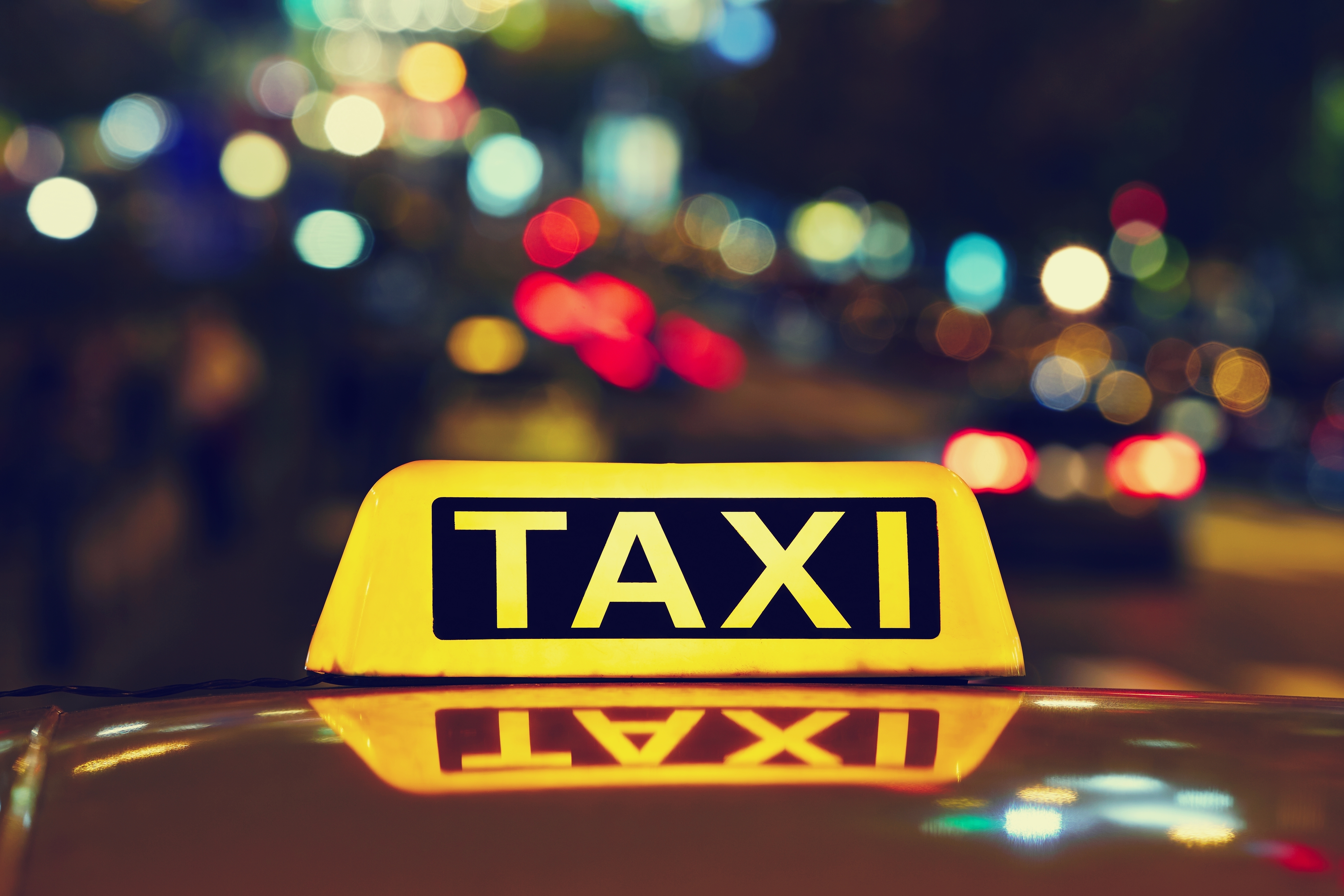 Taxi,Car,On,The,Street,At,Night