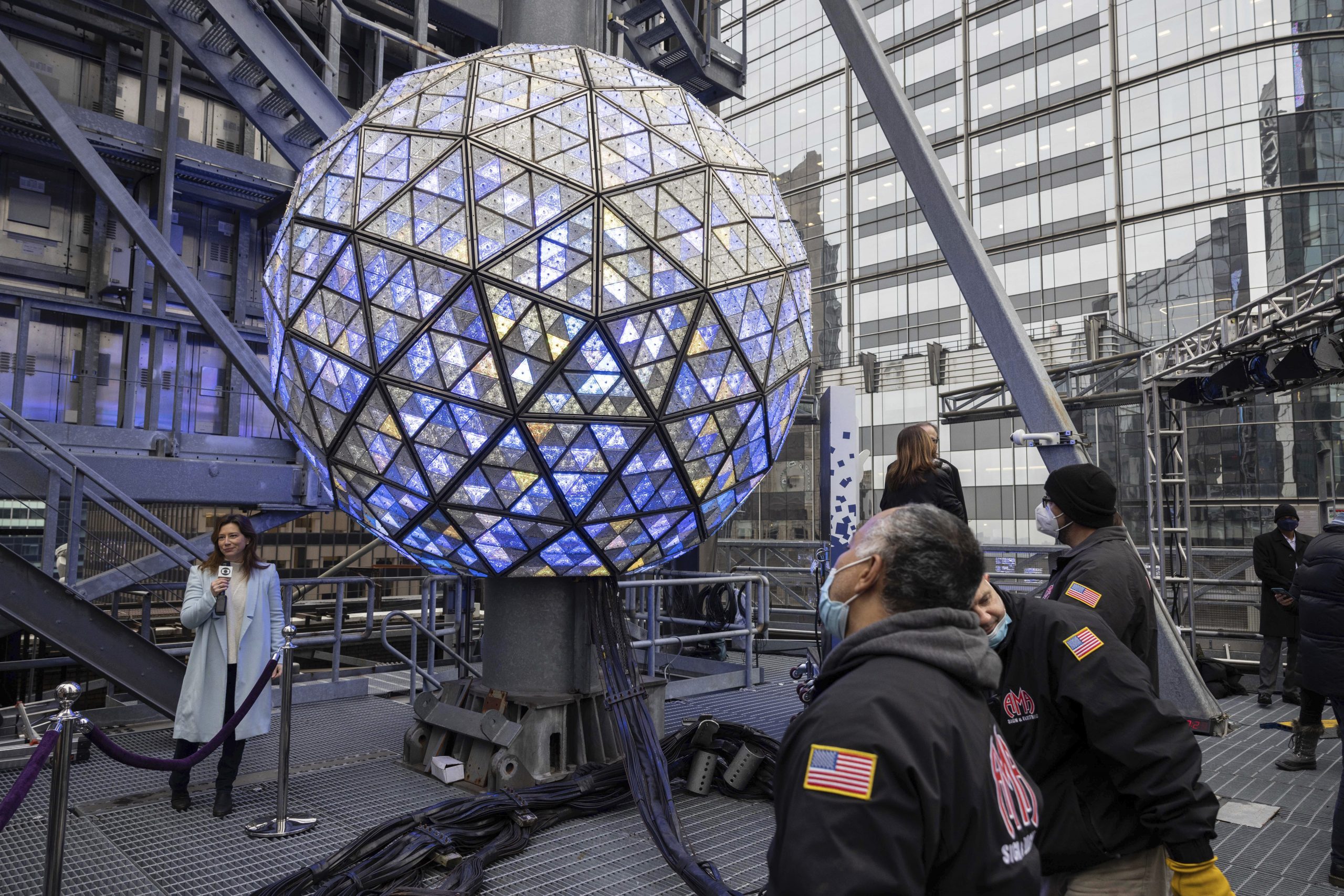 People work to light up the New Year's Eve Ball during the New Year's Eve Ball test at Times Square on Thursday, Dec. 30, 2021, in New York. (AP Photo/Yuki Iwamura)