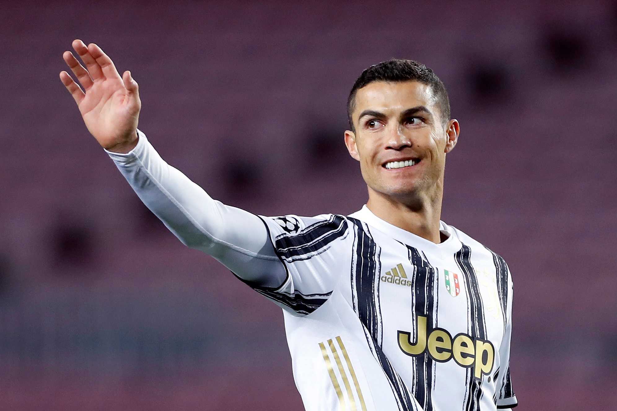 epa08871291 Juventus' striker Cristiano Ronaldo celebrates after scoring the 0-1 during the UEFA Champions League group G between FC Barcelona and Juventus at Camp Nou stadium in Barcelona, Catalonia, Spain, 08 December 2020.  EPA-EFE/Alberto Estevez