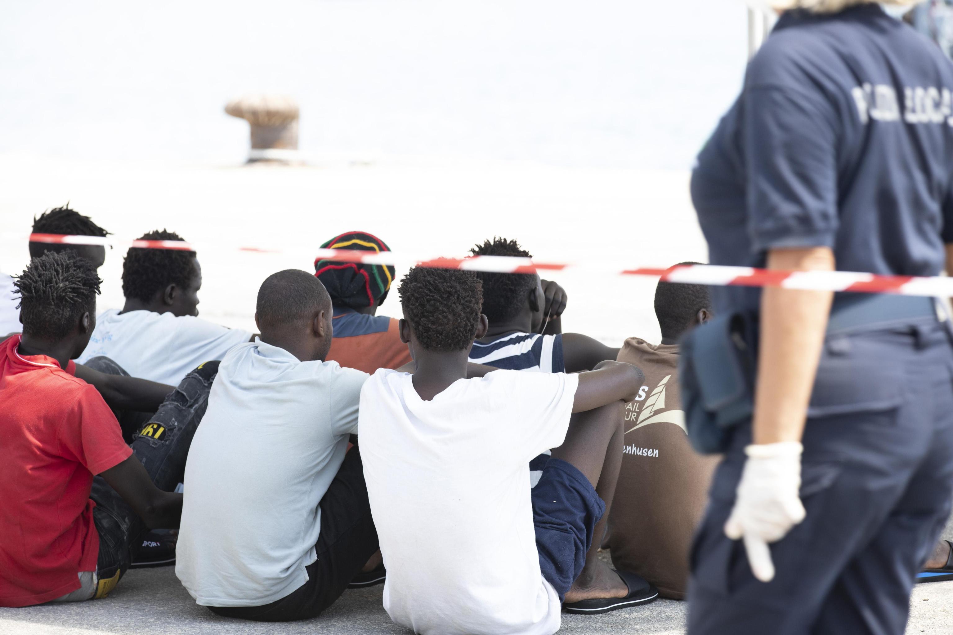 Migrants after the German NGO migrant rescue ship Eleonore docked in the Sicilian port of Pozzallo