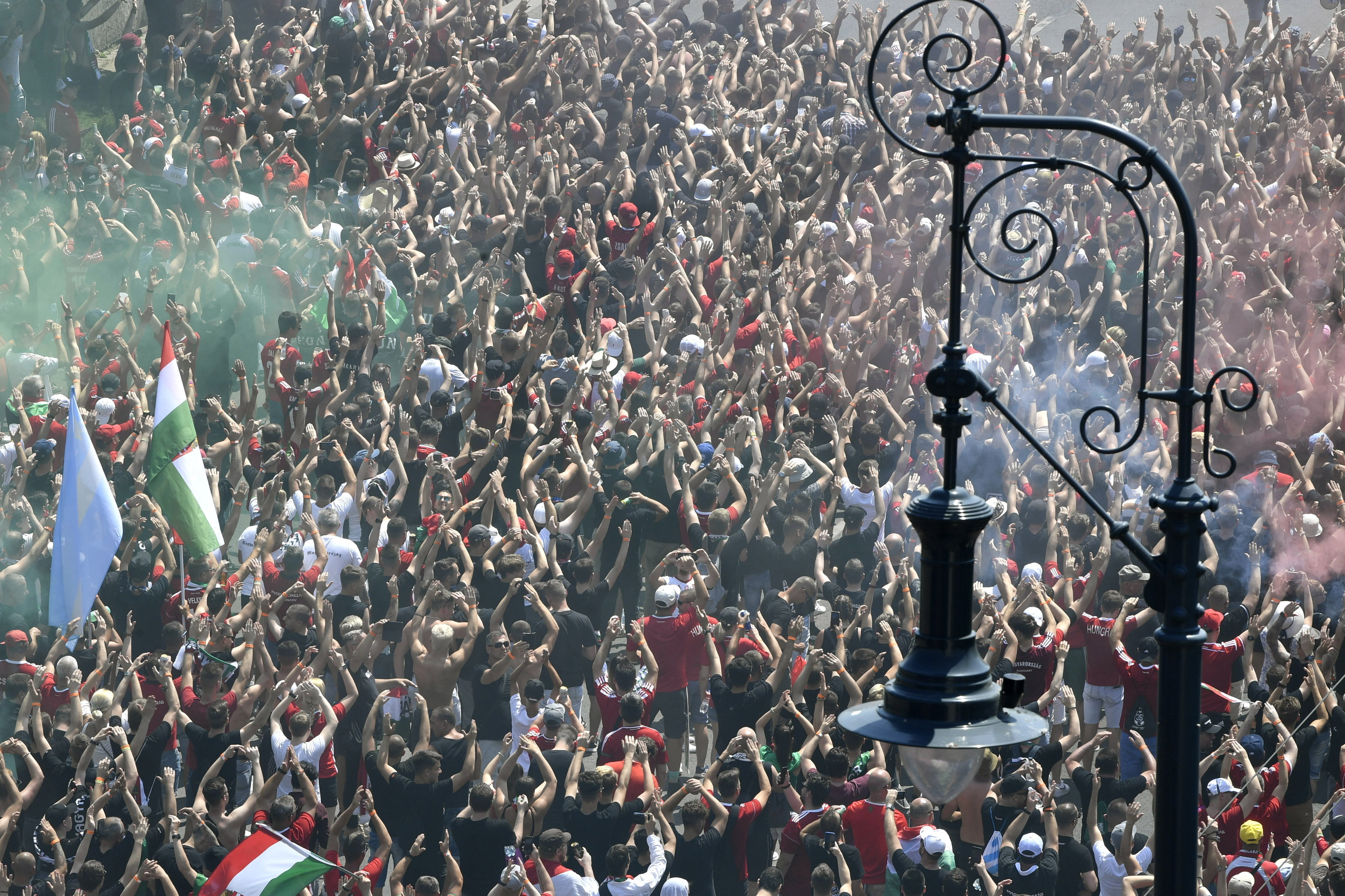 epa09285079 Hungarian fans march towards the Puskas Arena in Budapest, Hungary, 19 June 2021, just hours before Hungary will face France in their UEFA EURO 2020 group F preliminary round soccer match.  EPA-EFE/ZOLTAN MATHE HUNGARY OUT