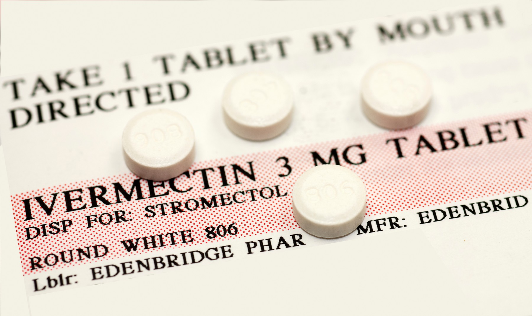 Ivermectin pills (a broad-spectrum antiparasitic agent) on top of instruction label