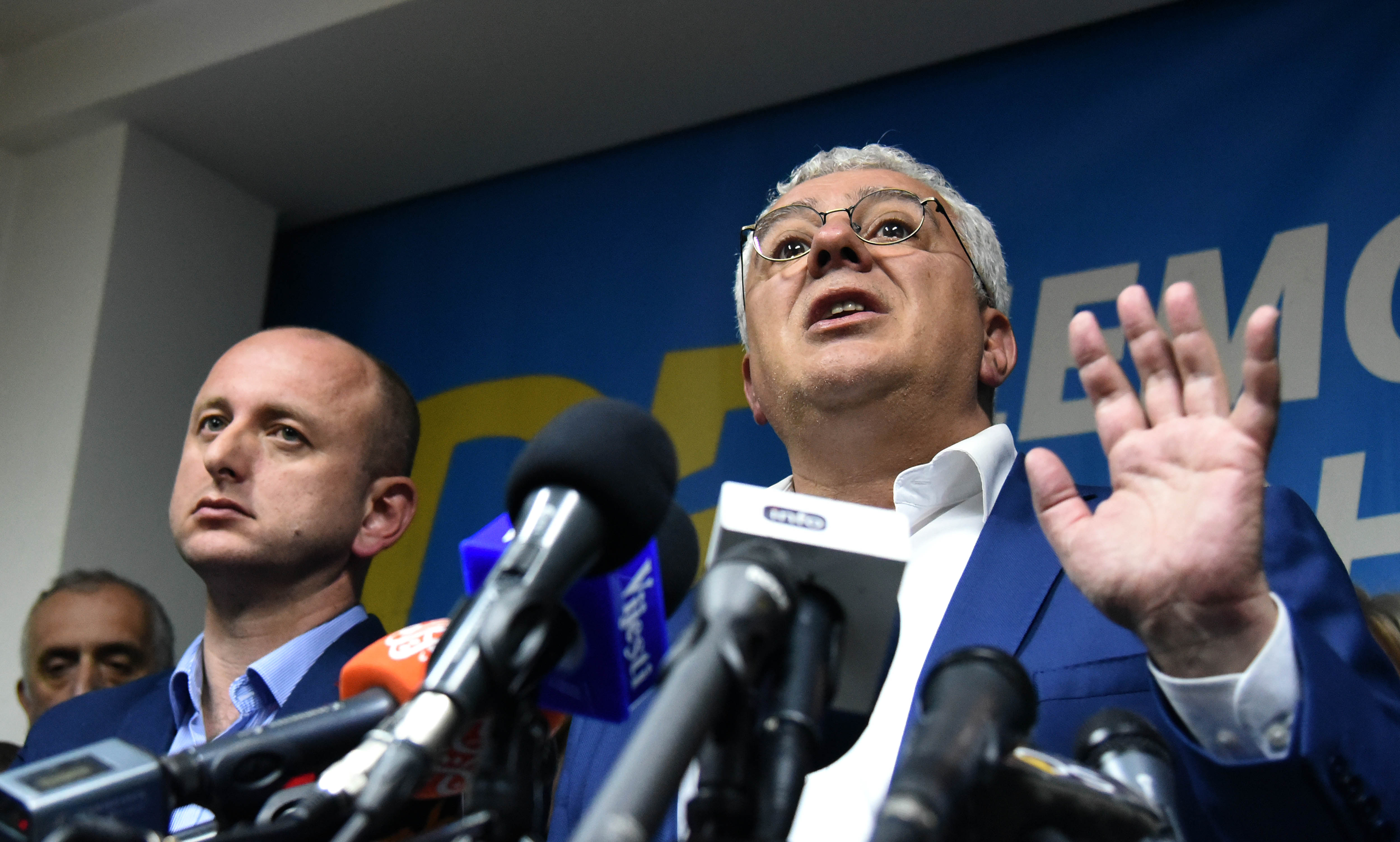 Two Russian intelligence officers and two opposition politicians were among 13 people sentenced