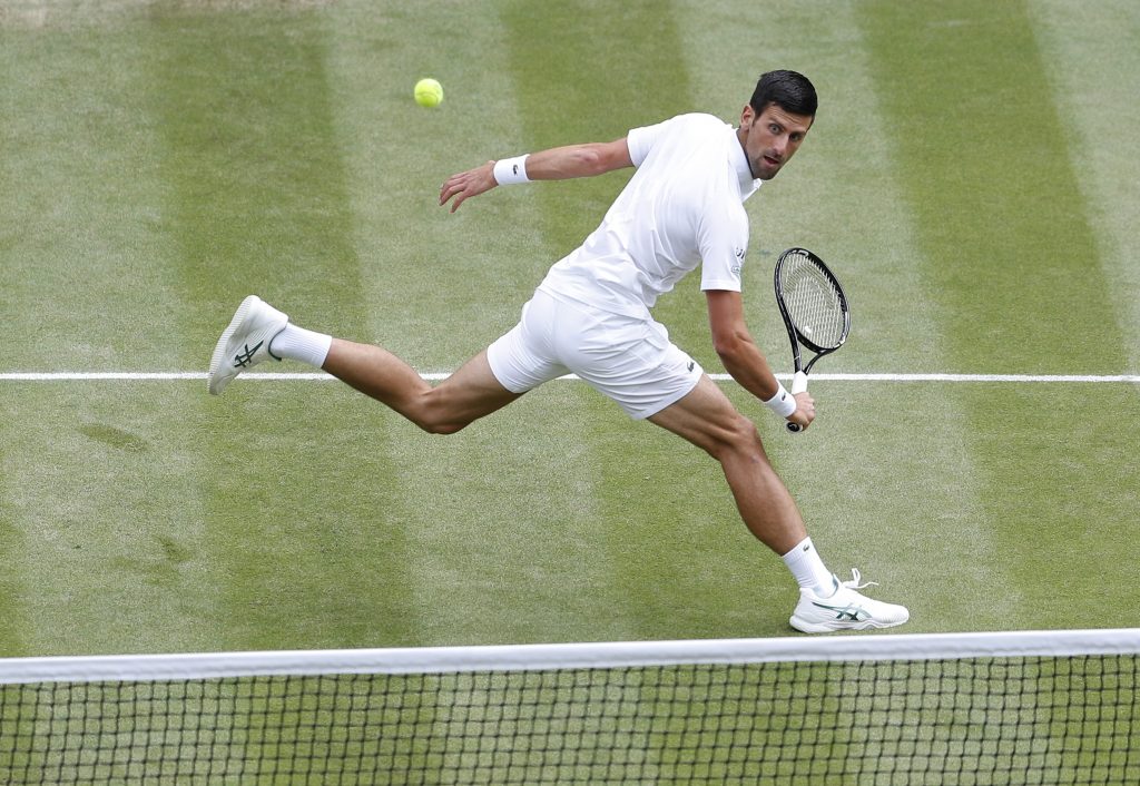 epa09337176 Novak Djokovic of Serbia in action against Matteo Berrettini of Italy during the men's final at the Wimbledon Championships, Wimbledon, Britain 11 July 2021.  EPA-EFE/Peter Nicholls / POOL