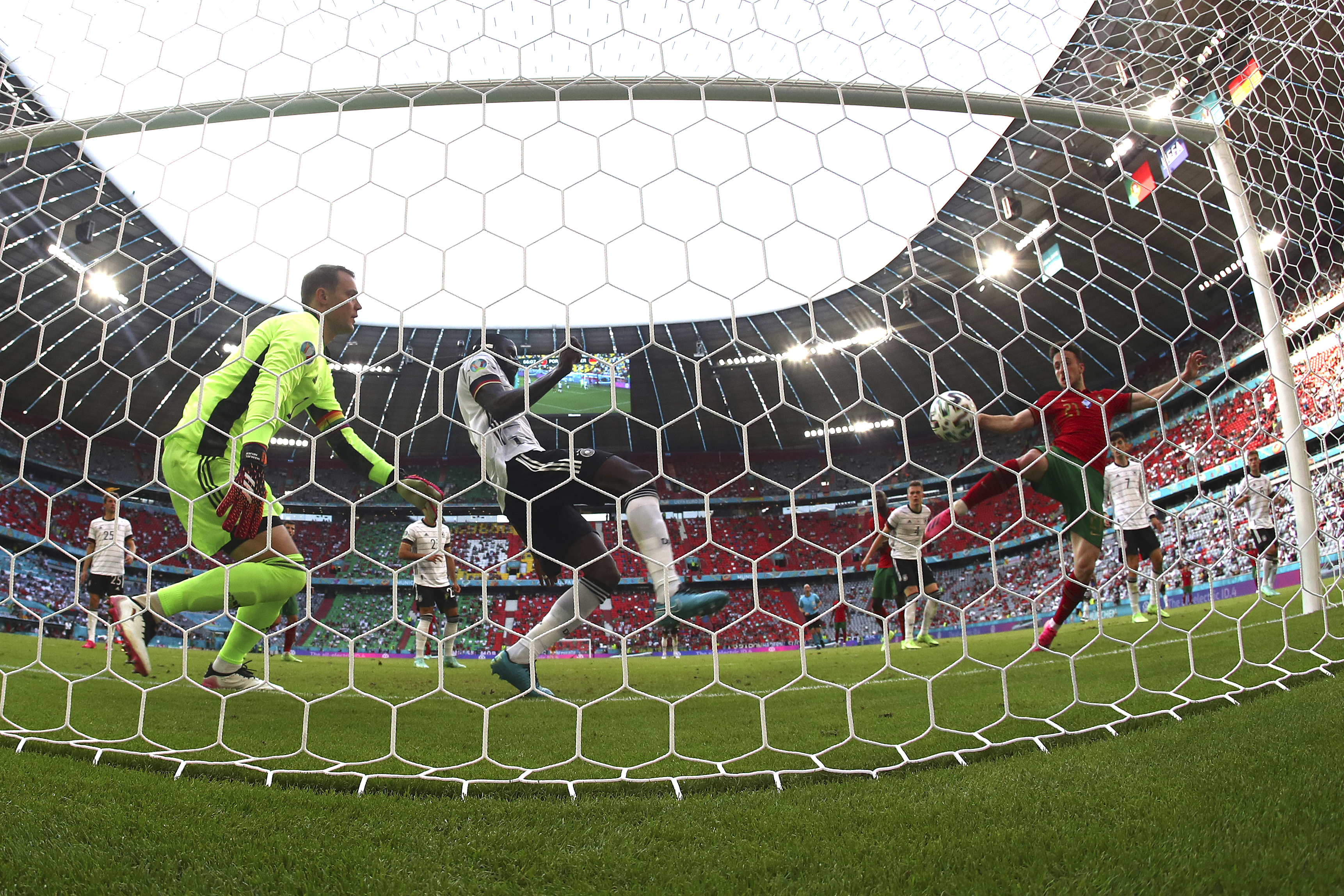Portugal's Diogo Jota scores during the Euro 2020 soccer championship group F match between Portugal and Germany at football arena stadium in Munich, Saturday, June 19, 2021. (AP Photo/Matthias Schrader,)