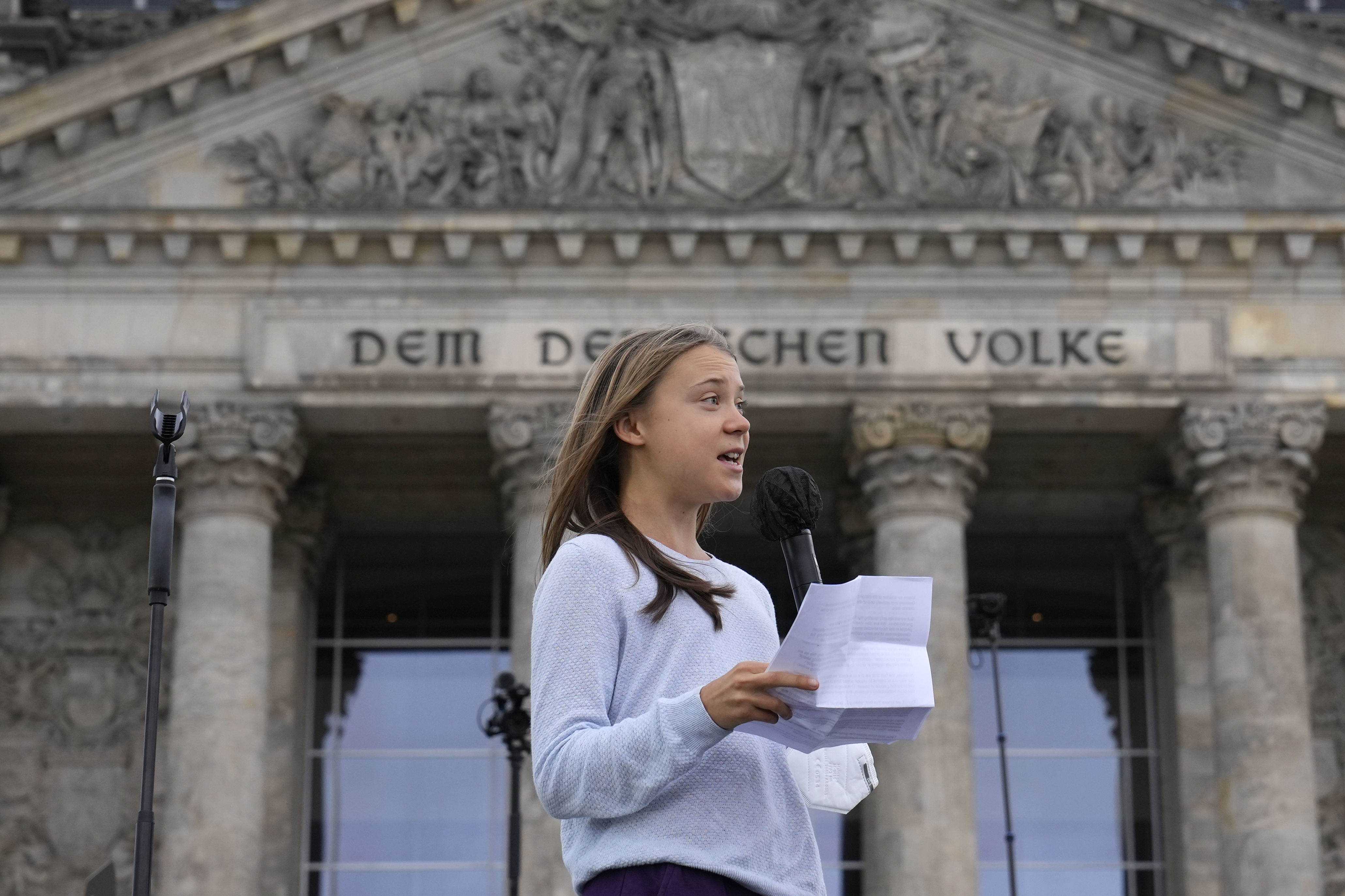 Swedish climate activist Greta Thunberg holds a speech during a Fridays for Future global climate strike in front of a parliemanet building in Berlin, Germany, Friday, Sept. 24, 2021. (AP Photo/Michael Sohn)