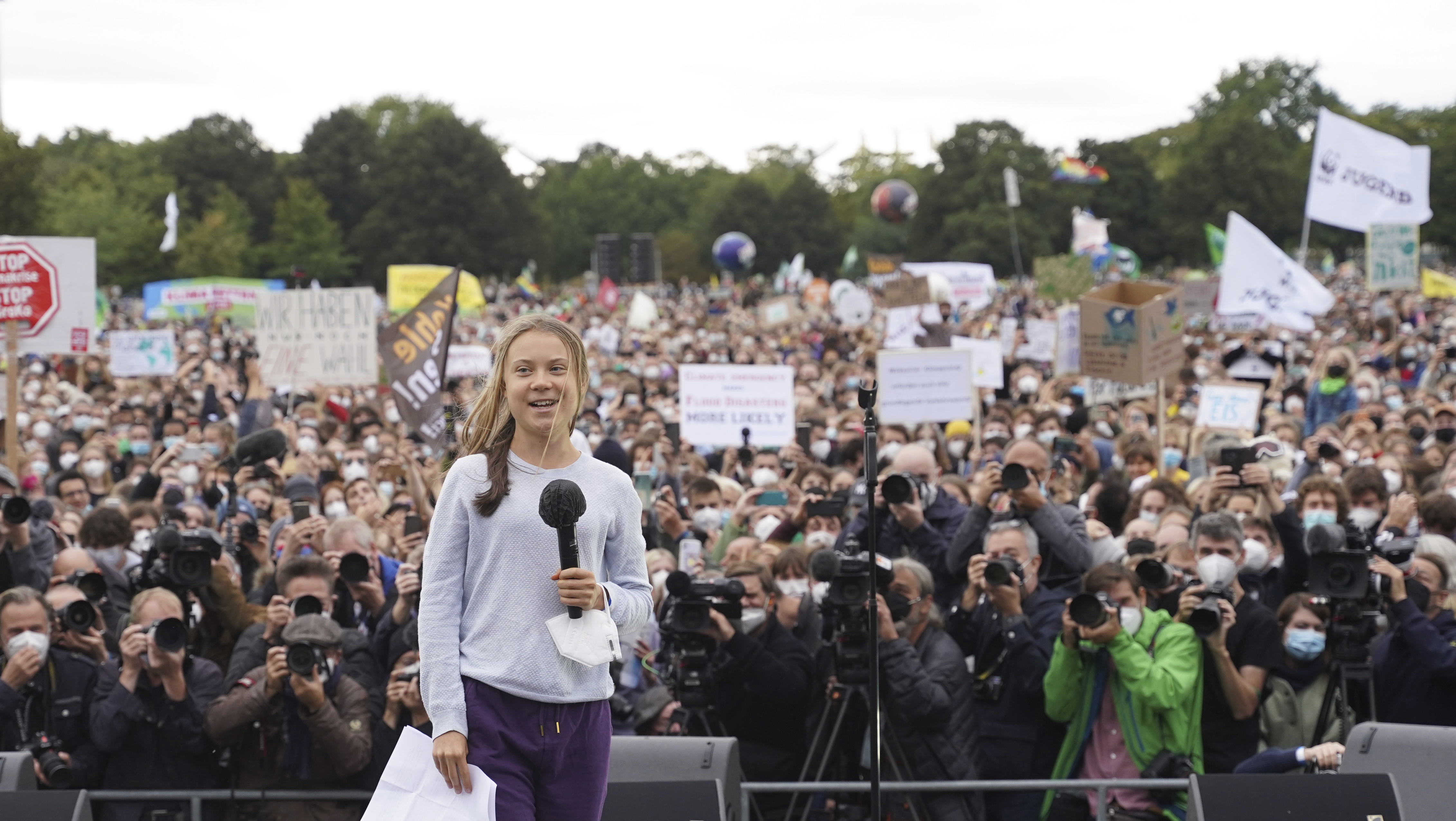 Swedish climate activist Greta Thunberg at a stage during a Fridays for Future global climate strike in Berlin, Germany, Friday, Sept. 24, 2021. (Joerg Carstensen/dpa via AP)