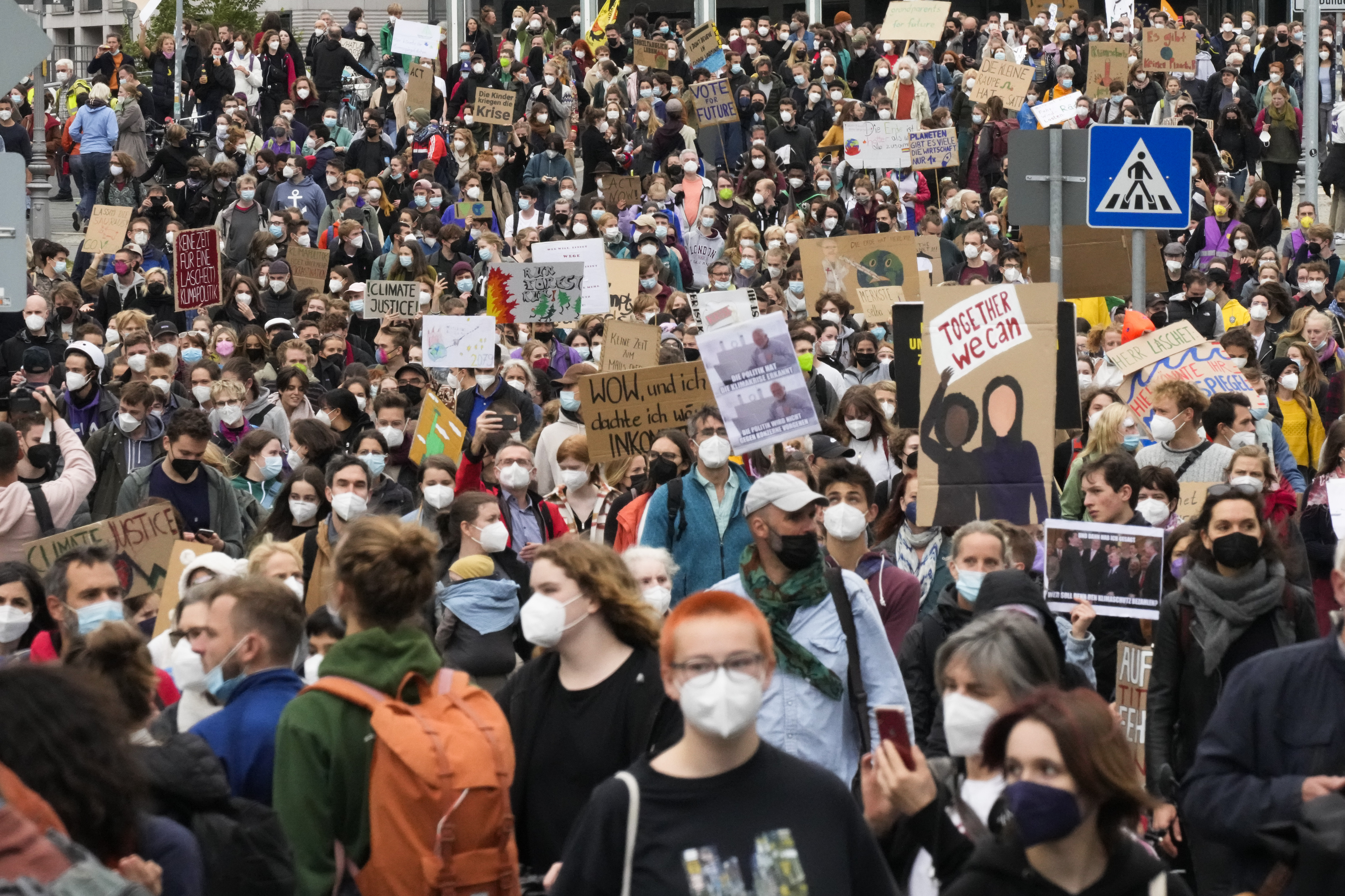 People attend a demonstration as part of a Fridays for Future global climate strike in Berlin, Germany, Friday, Sept. 24, 2021. (AP Photo/Markus Schreiber)