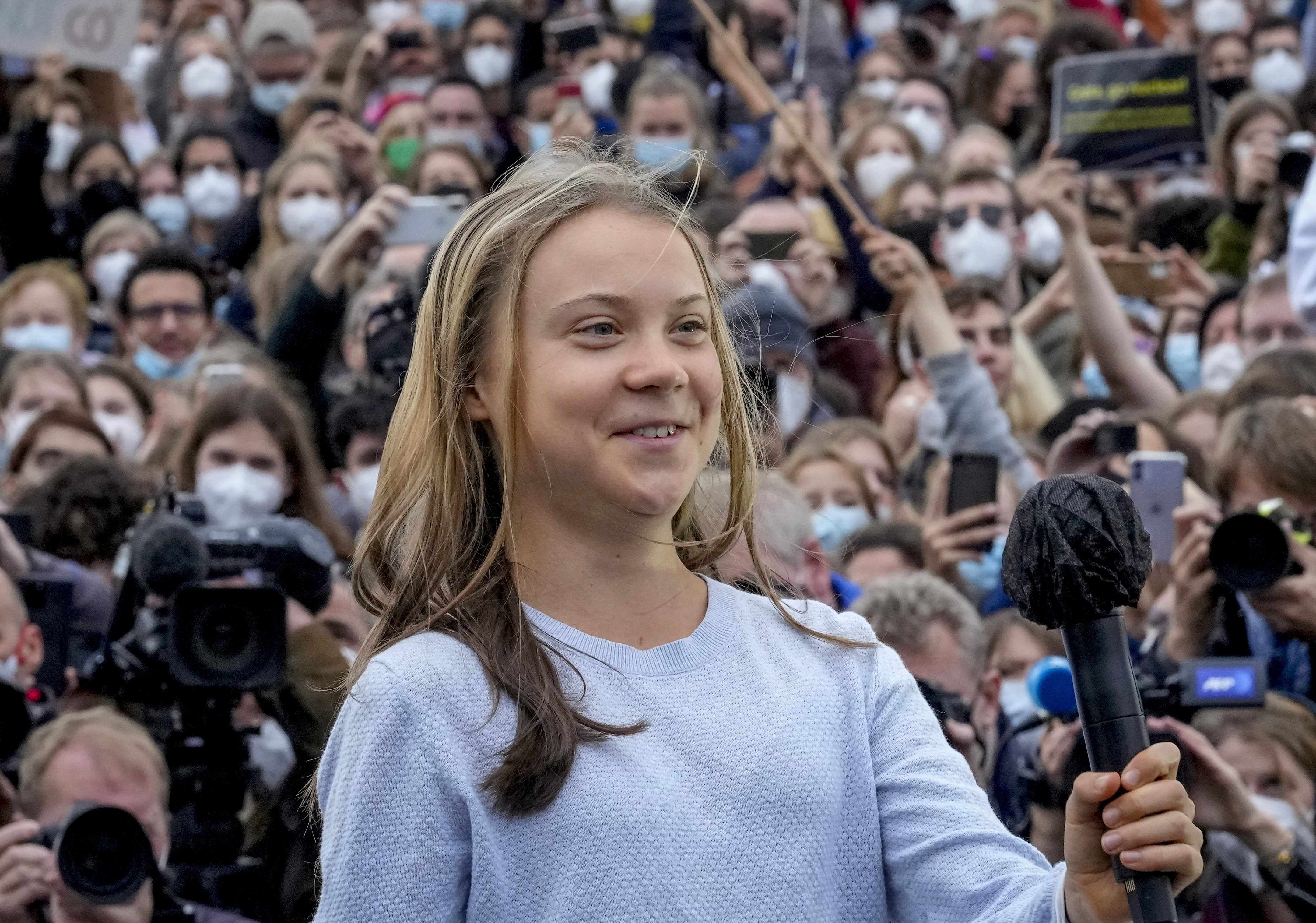 Swedish climate activist Greta Thunberg arrives at stage during a Fridays for Future global climate strike in Berlin, Germany, Friday, Sept. 24, 2021. (AP Photo/Markus Schreiber)