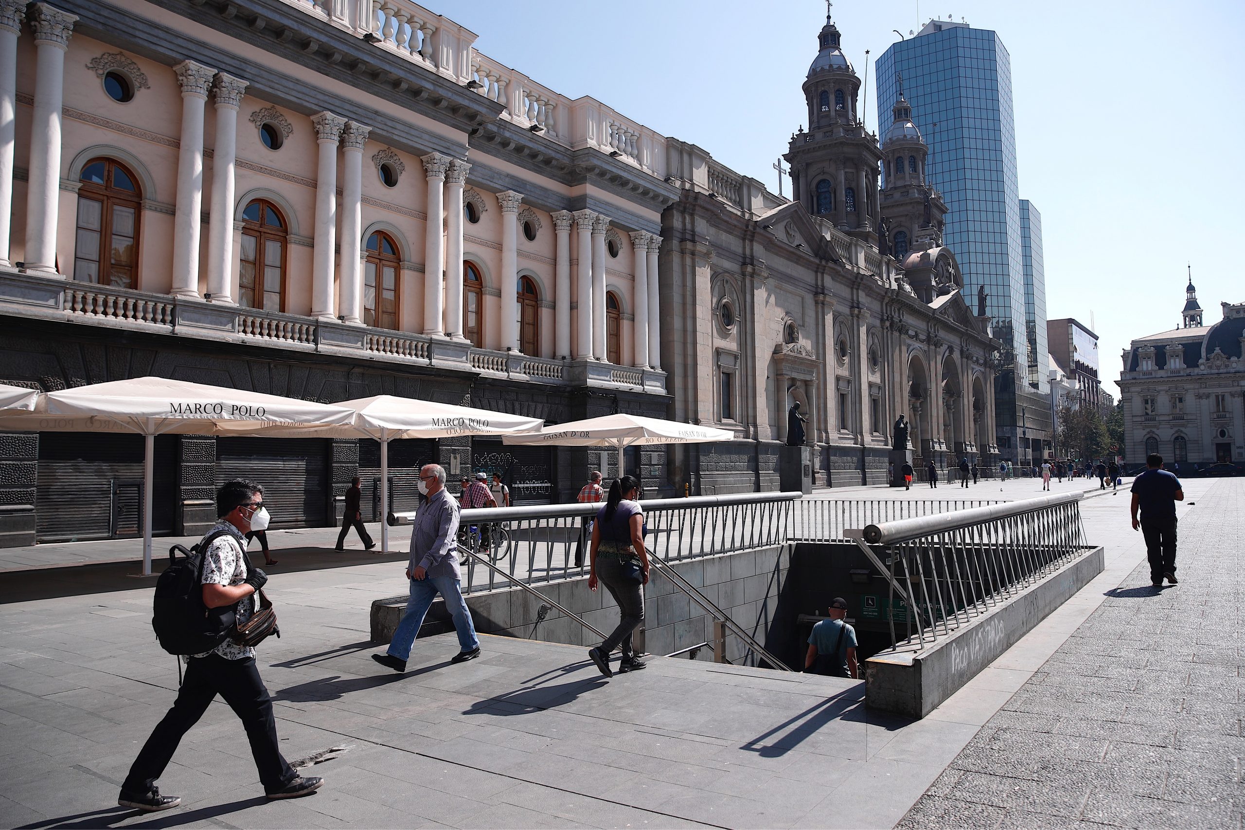 epa08349271 People walk near a metro station in Santiago, Chile, 07 April 2020. Six city districts of the capital are under quarantine at least until 09 April 2020, from 10 PM until 5 AM there is a curfew in the whole city.  EPA-EFE/Alberto Valdes