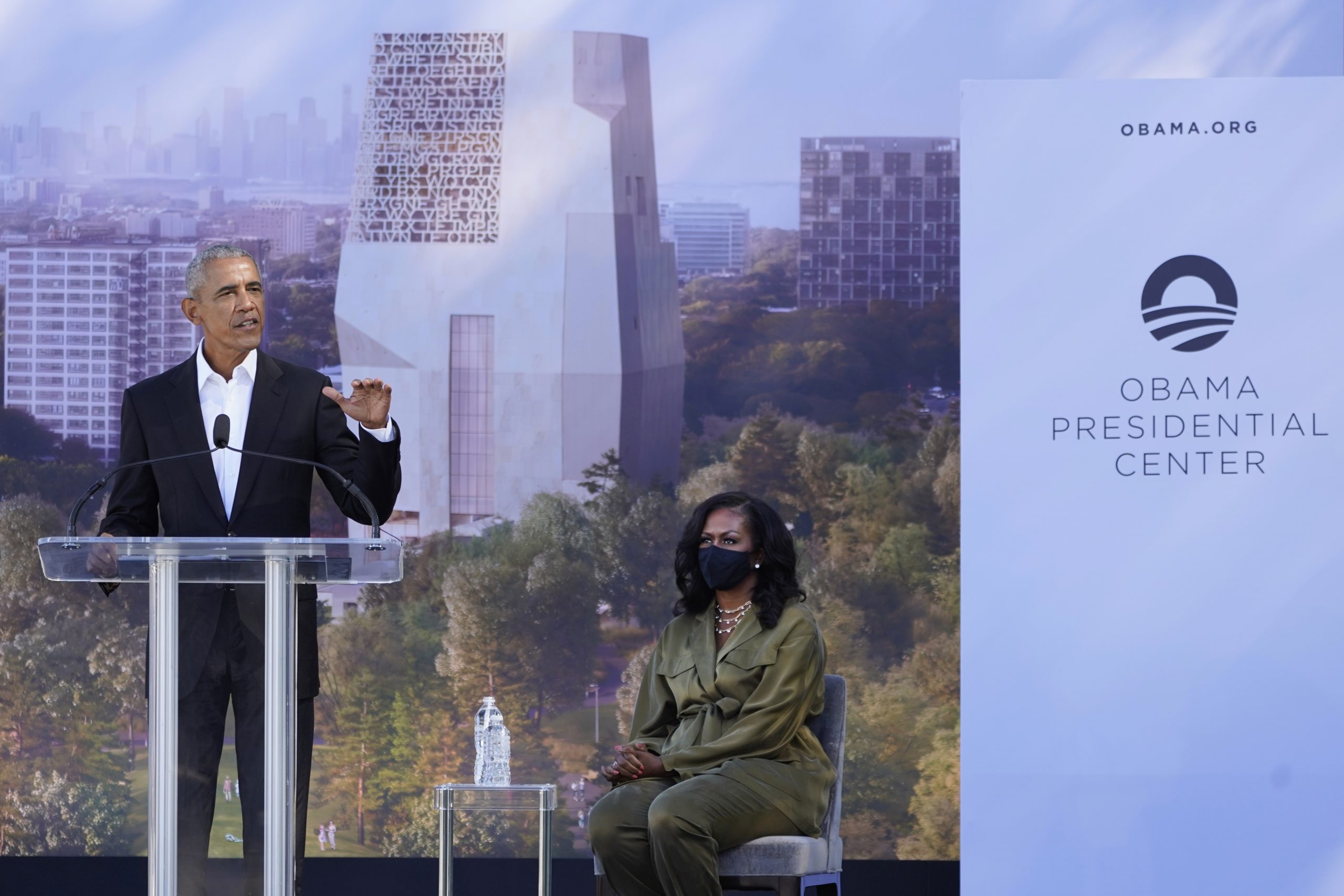 Former President Barack Obama speaks as former first lady Michelle Obama listens during a groundbreaking ceremony for the Obama Presidential Center Tuesday, Sept. 28, 2021, in Chicago. (AP Photo/Charles Rex Arbogast)