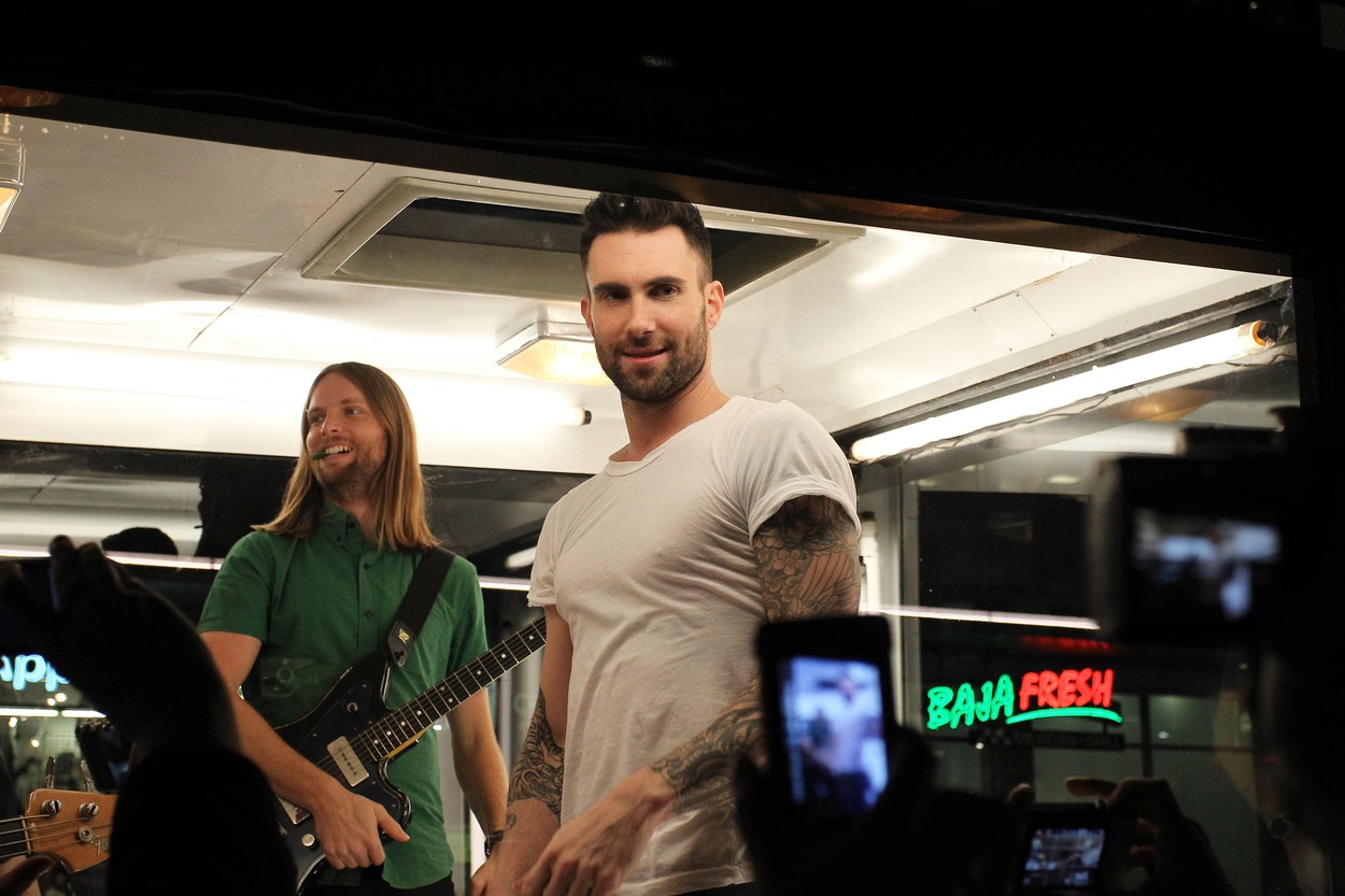 Adam Levine and his band Maroon 5 film a music video in a glass box on iconic Hollywood Blvd