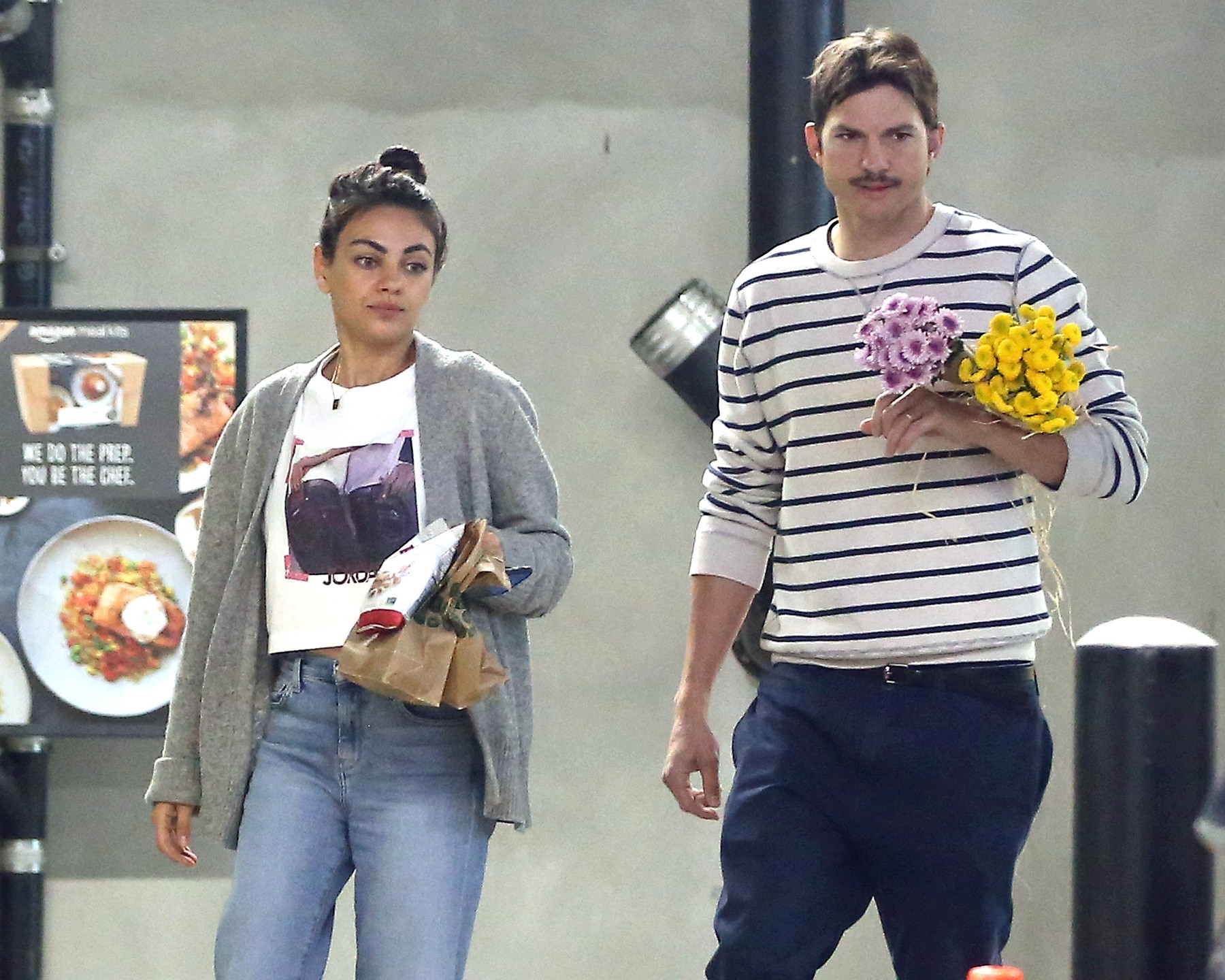 EXCLUSIVE: Mila Kunis and Ashton Kutcher out in Los Angeles buying some flowers