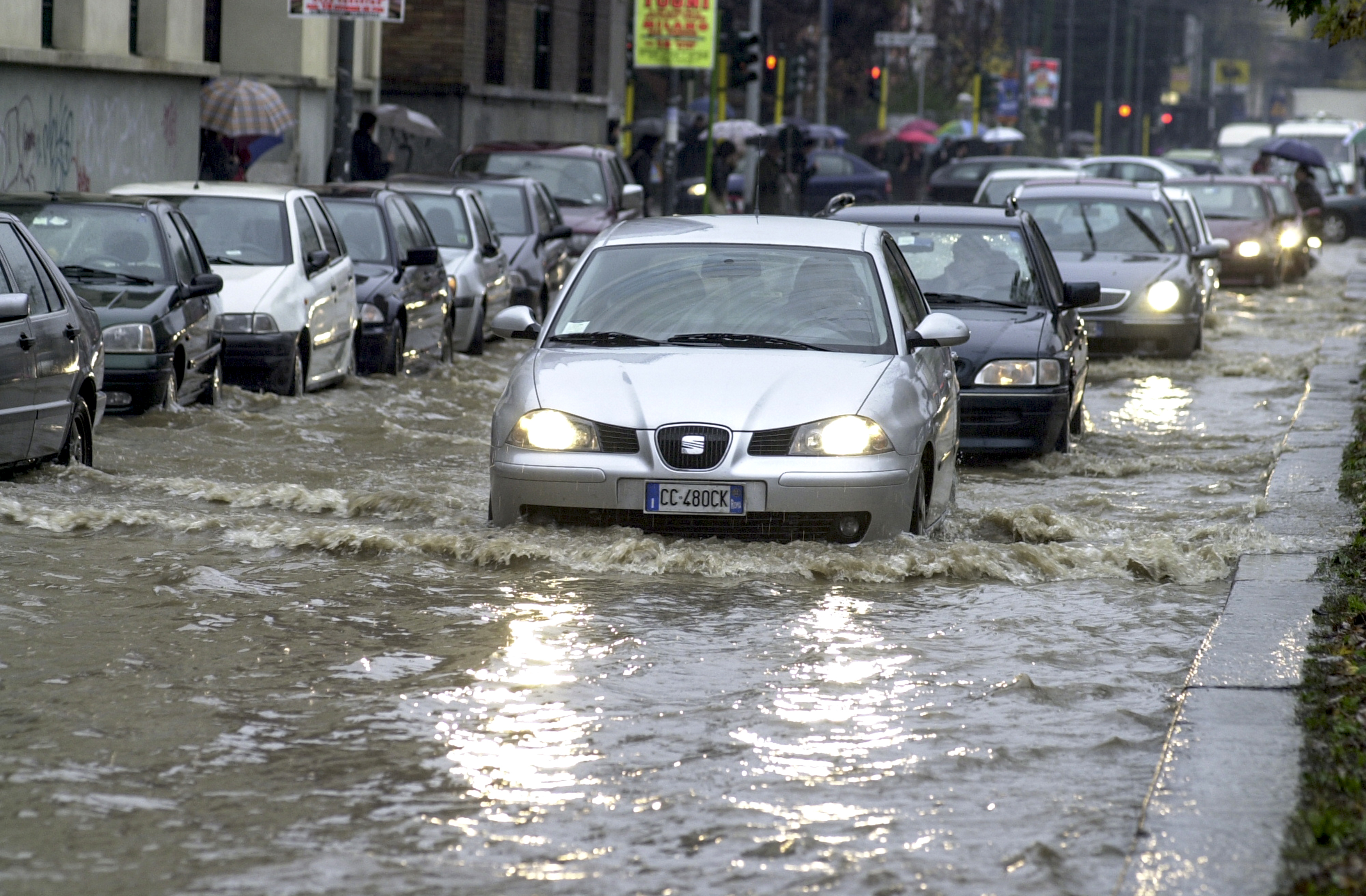 Milan,,Italy-november,26,,2002:,Cars,Driving,On,A,Flooded,Road