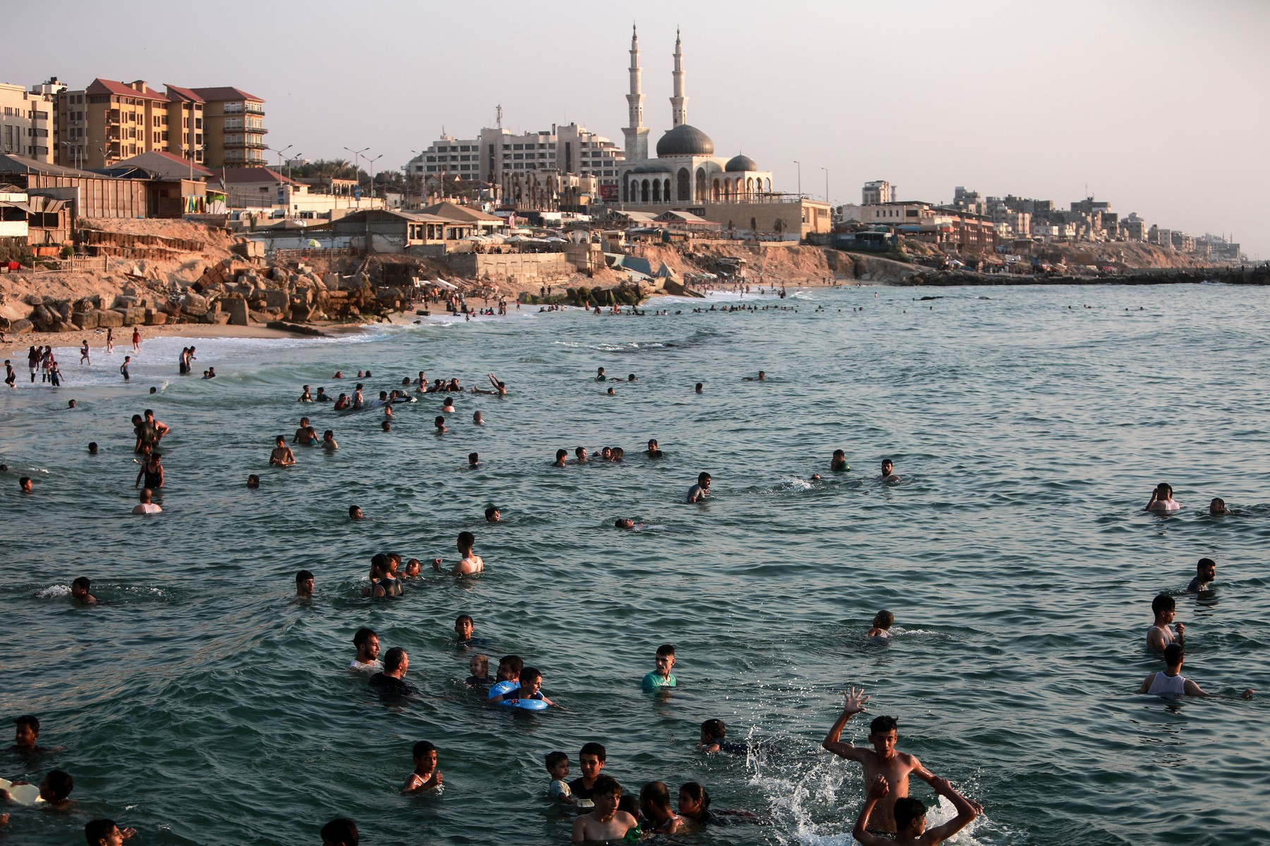Palestinians enjoy their time at the beach of Gaza sea during a hot day, Gaza city, Gaza Strip, Palestinian Territory - 06 Aug 2021