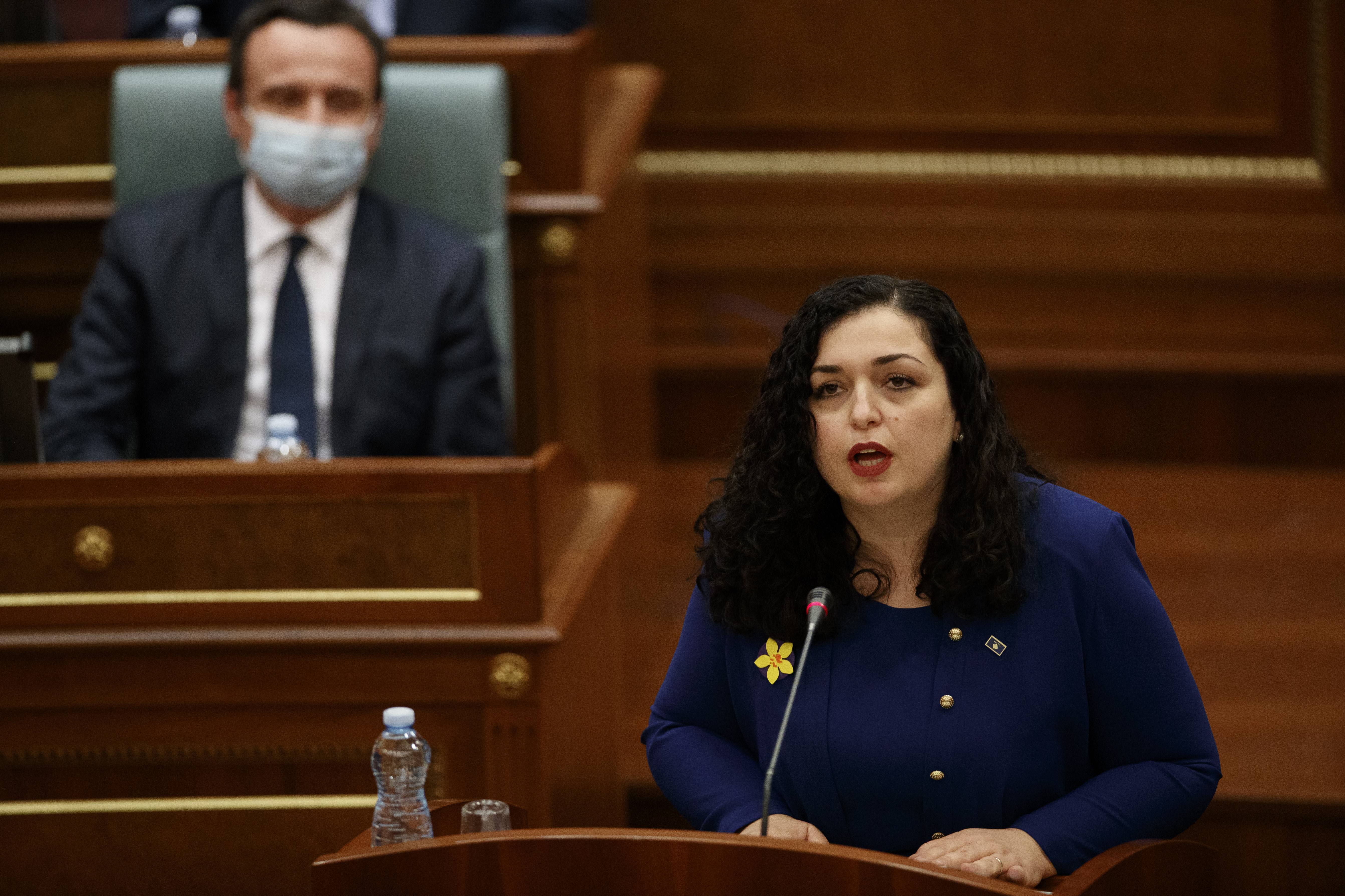 epa09116008 Newly elected Kosovo President Vjosa Osmani delivers a speech to the delegates after she was sworn-in at the parliament in Pristina, Kosovo, 04 April 2021.  EPA-EFE/VALDRIN XHEMAJ