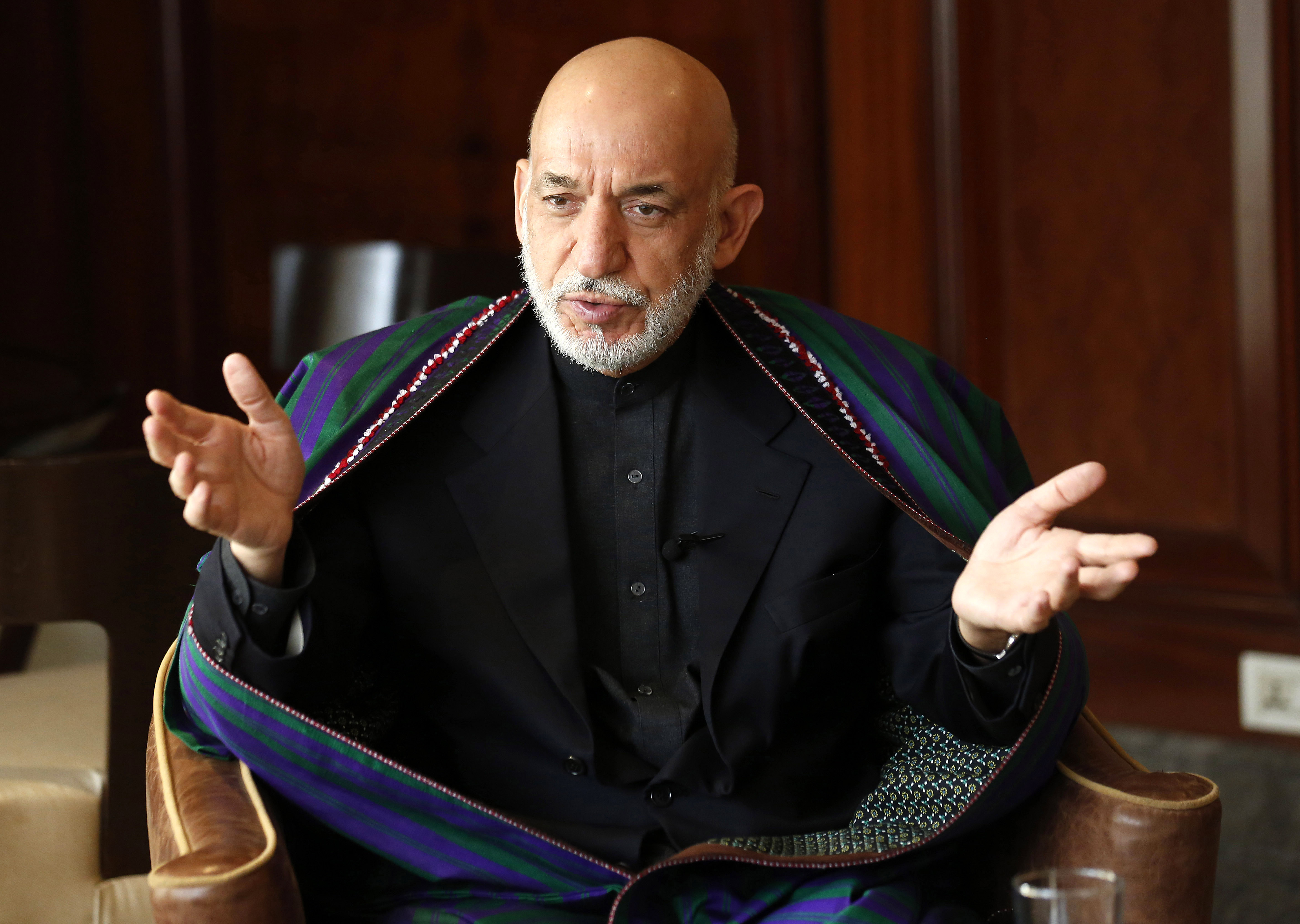 Former Afghan President Karsai gives an interview in New Delhi