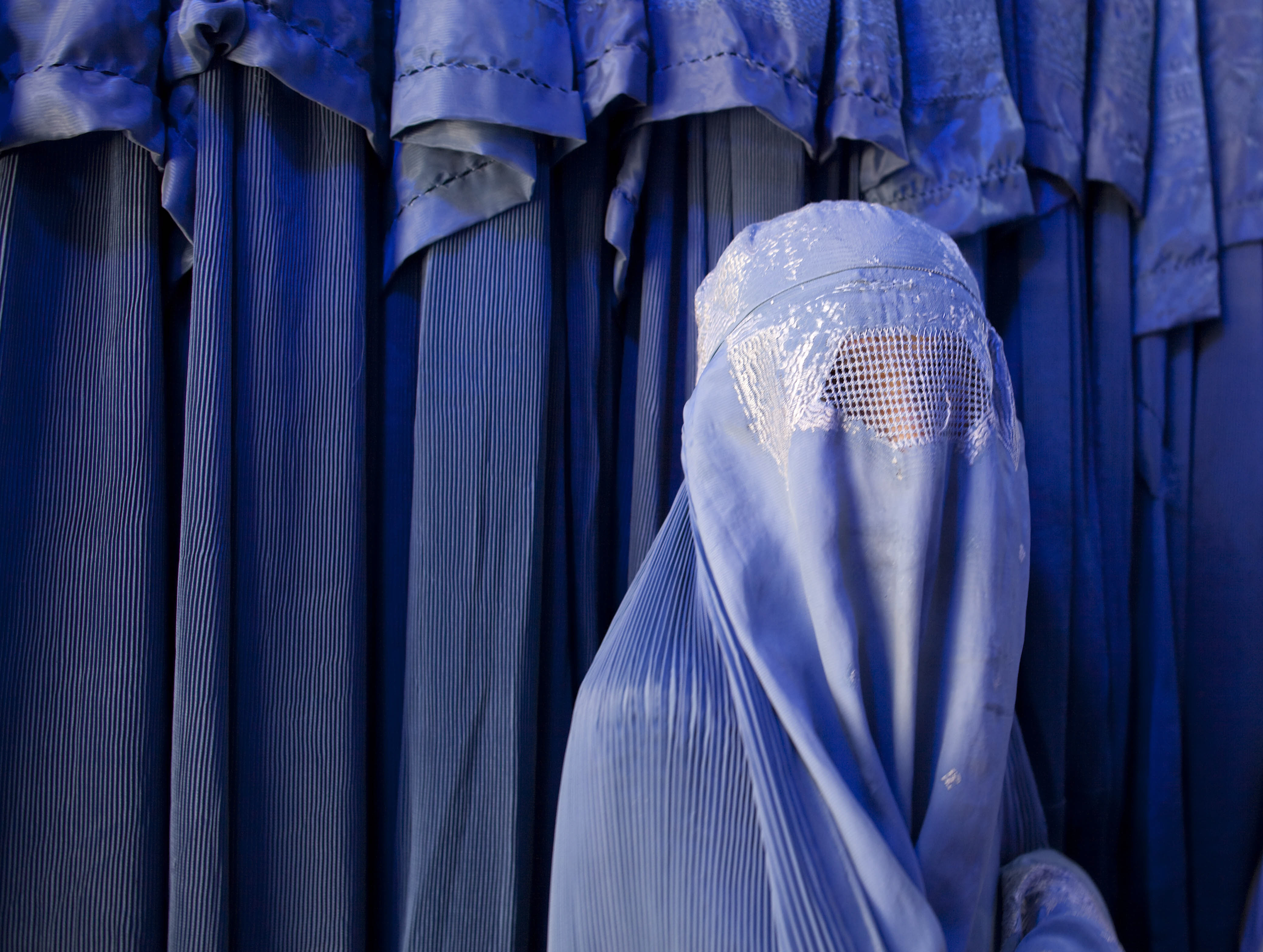 Afghan women browse the market. burka hidzab
