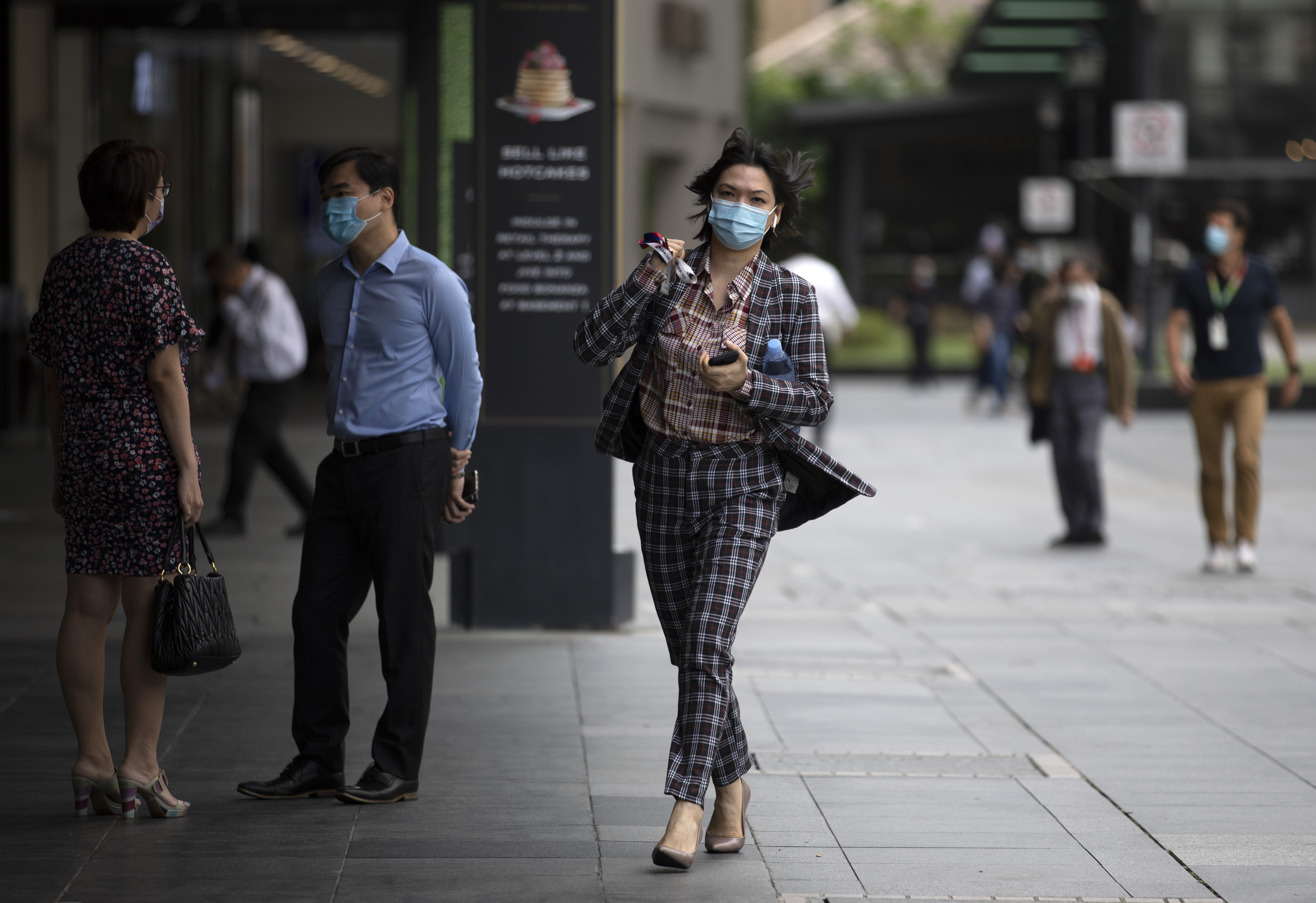 Singapore's economy contracted less than expected in the third quarter