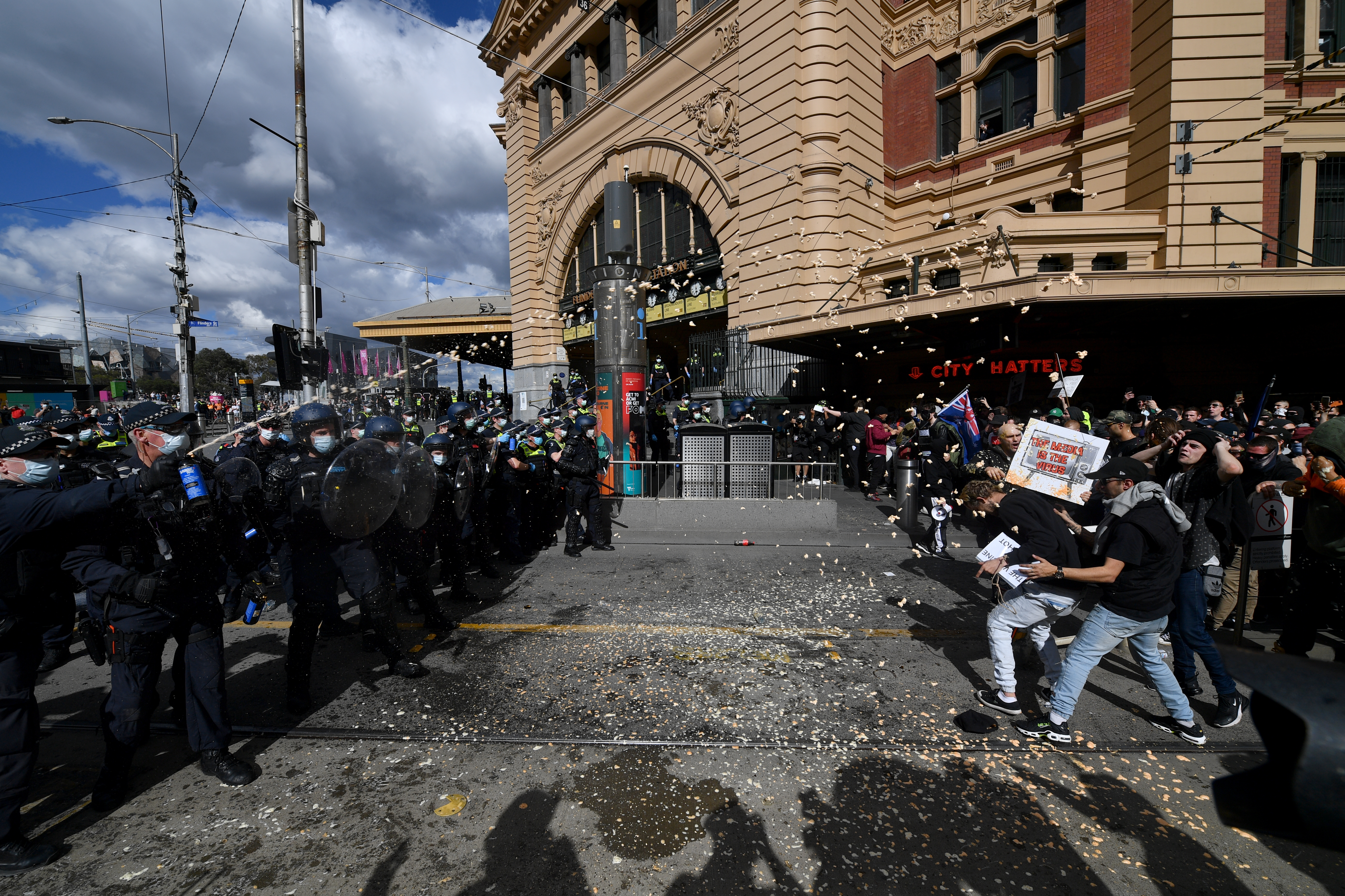 epa09422751 Protesters are pepper sprayed by police during an anti-lockdown protest in the central business district of Melbourne, Australia, 21 August 2021.  EPA-EFE/JAMES ROSS AUSTRALIA AND NEW ZEALAND OUT