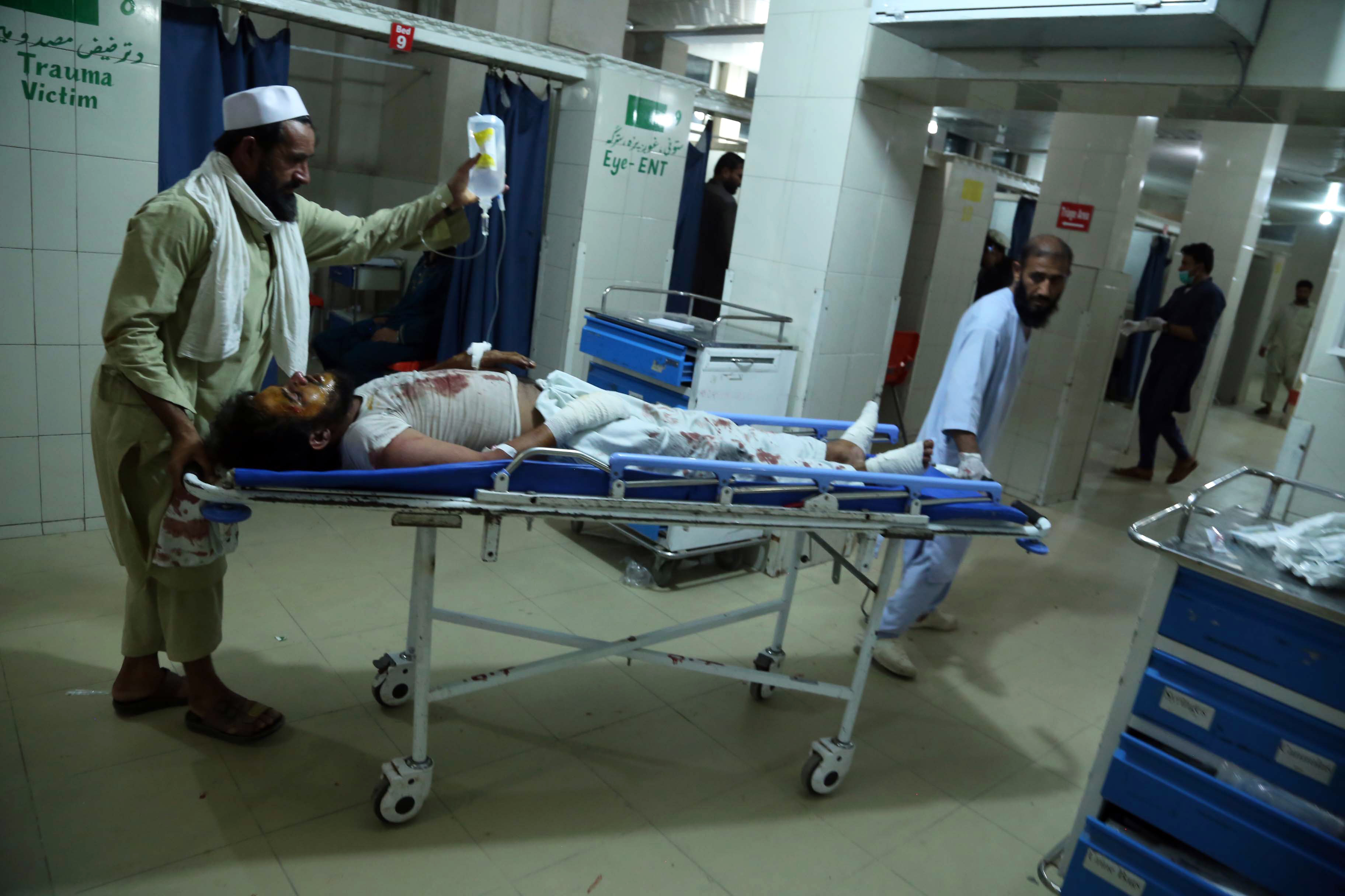 People injured by the bomb blast receive medical treatment
