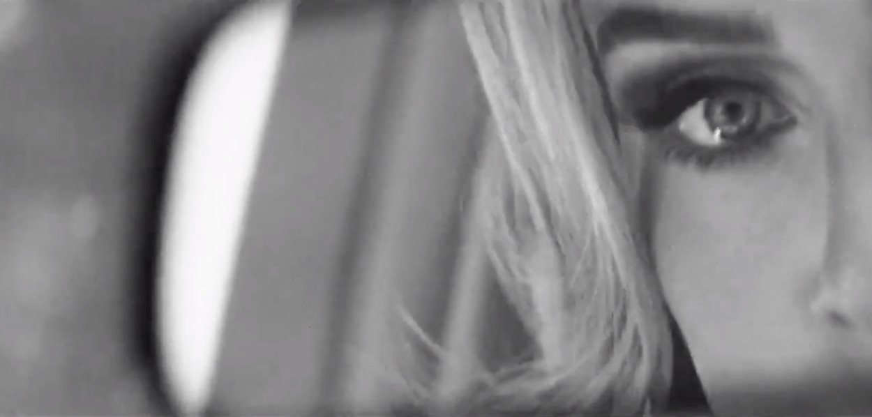Adele teases new music in bref black and white video clip