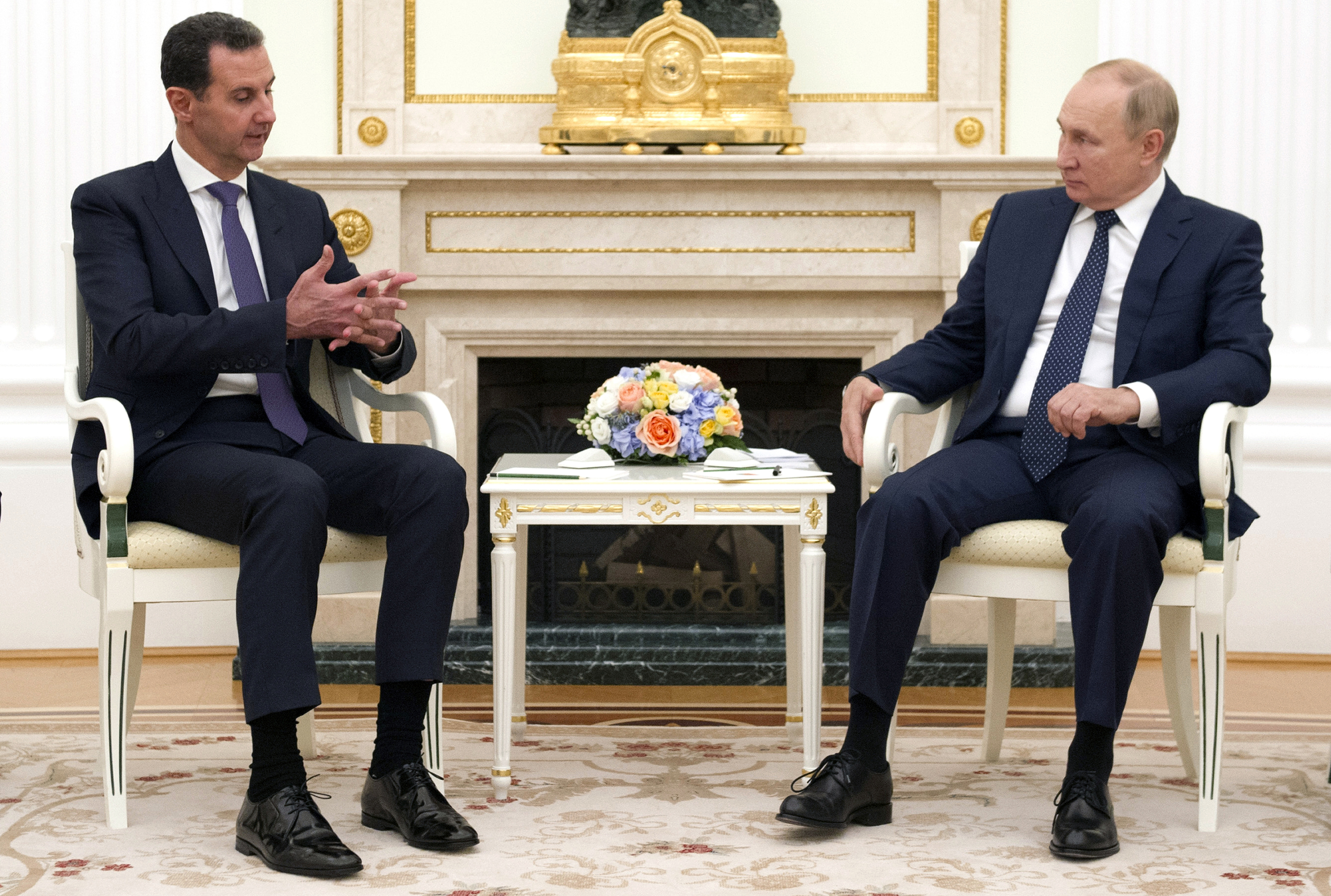 Russian President Vladimir Putin, right, sits with Syrian President Bashar Assad during their meeting in the Kremlin in Moscow, Russia, Monday, Sept. 13, 2021.