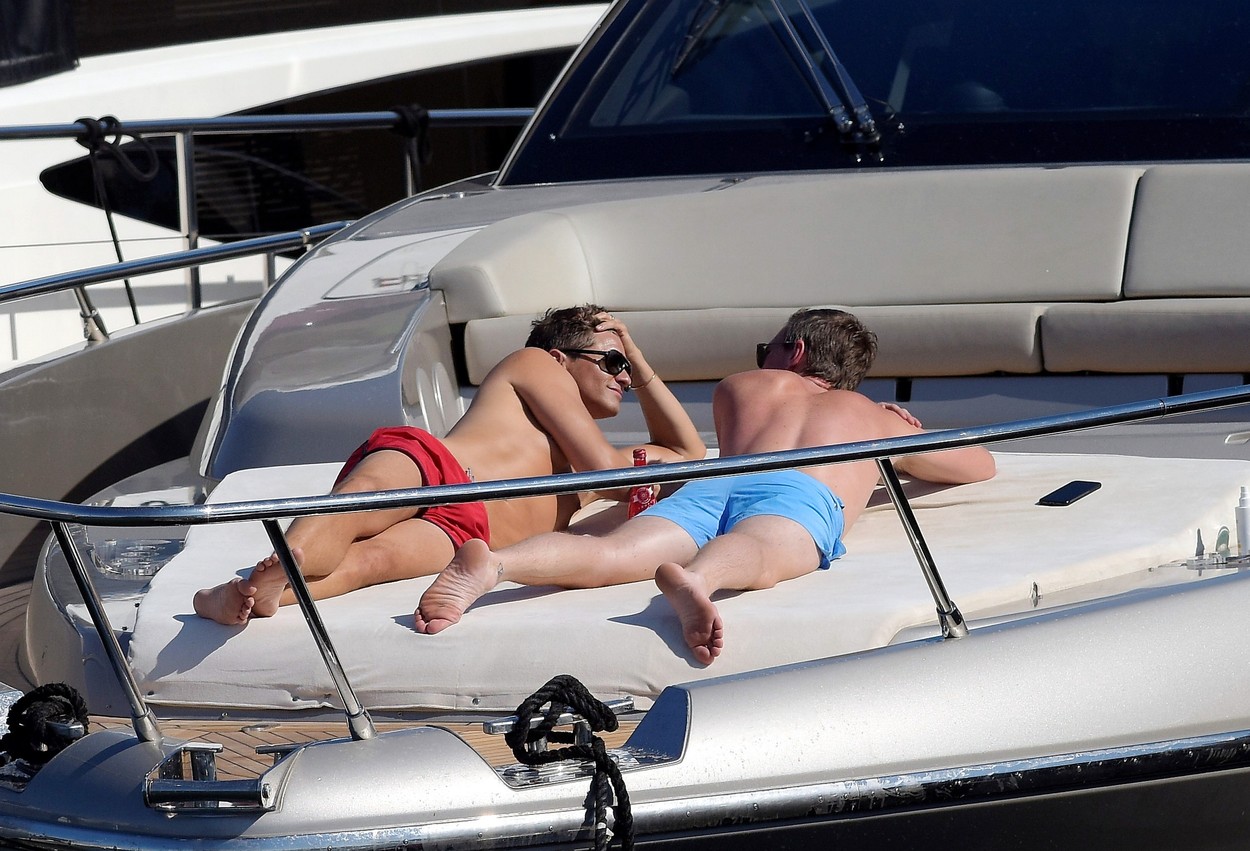 Neil Patrick and Harris David Burtka share a passionate kiss while enjoying the sun on a luxury yacht in Saint Tropez