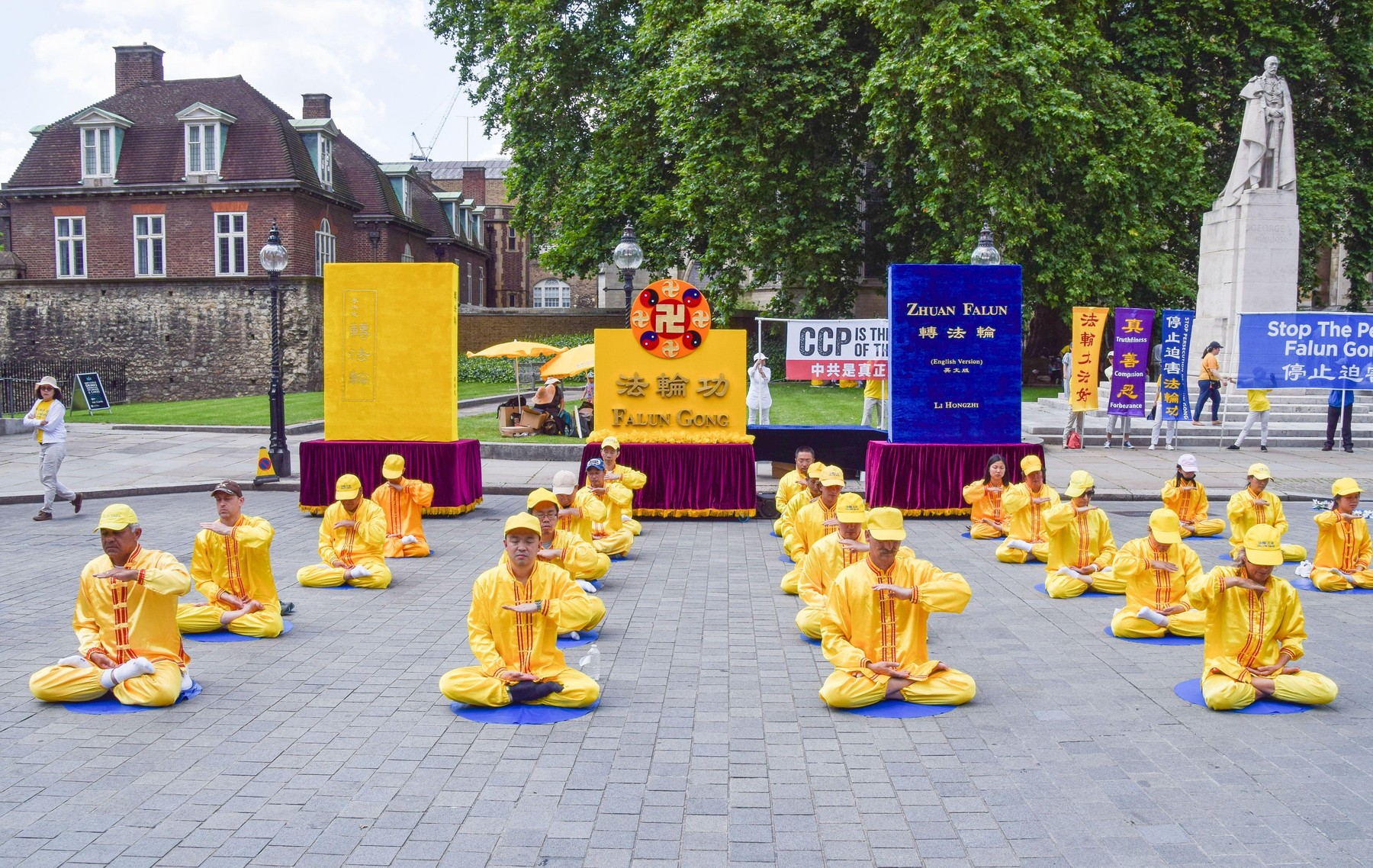 London, United Kingdom. 18th July 2021. Falun Gong practitioners and supporters gathered outside the Houses of Parliament to protest against the Chinese government's persecution, according to the protesters, of Falun Gong (also known as Falun Dafa) medita