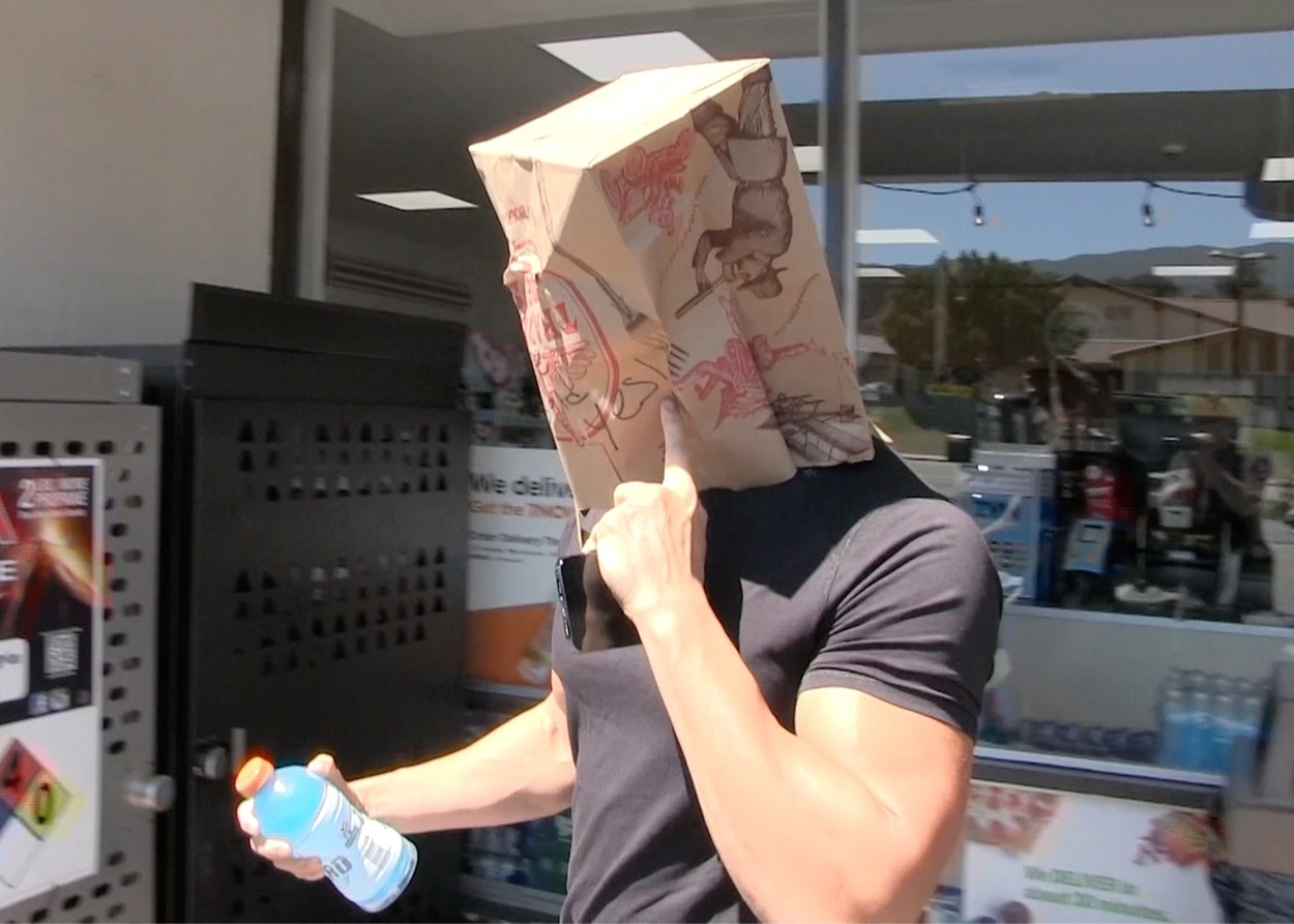 *EXCLUSIVE* Sam Asghari leaves 7-Eleven with a brown bag over his head that reads, 'She Said Yes' in Westlake - ** WEB MUST CALL FOR PRICING **