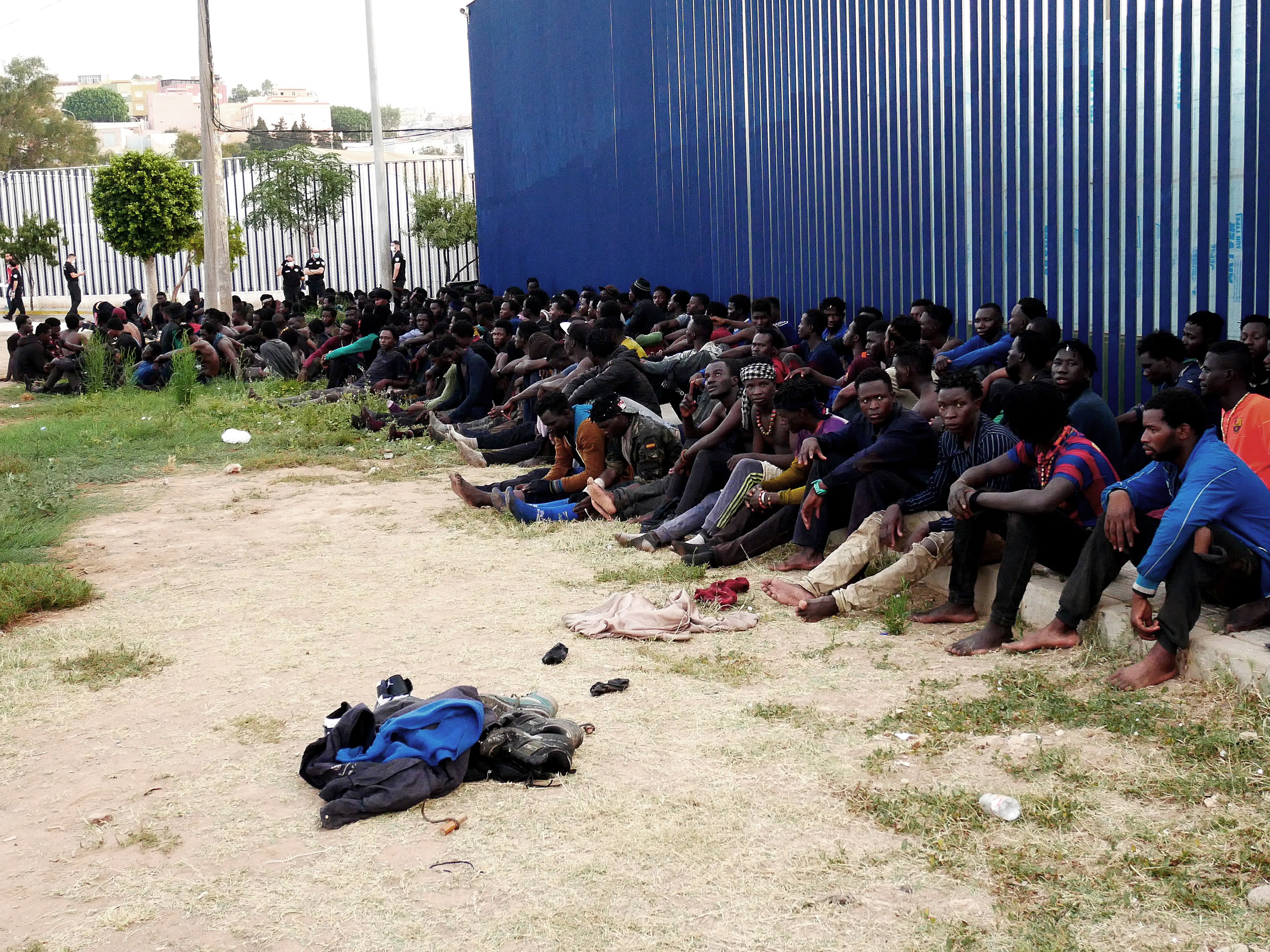 Some 300 migrants manage to reach Spain by jumping border fence in Melilla