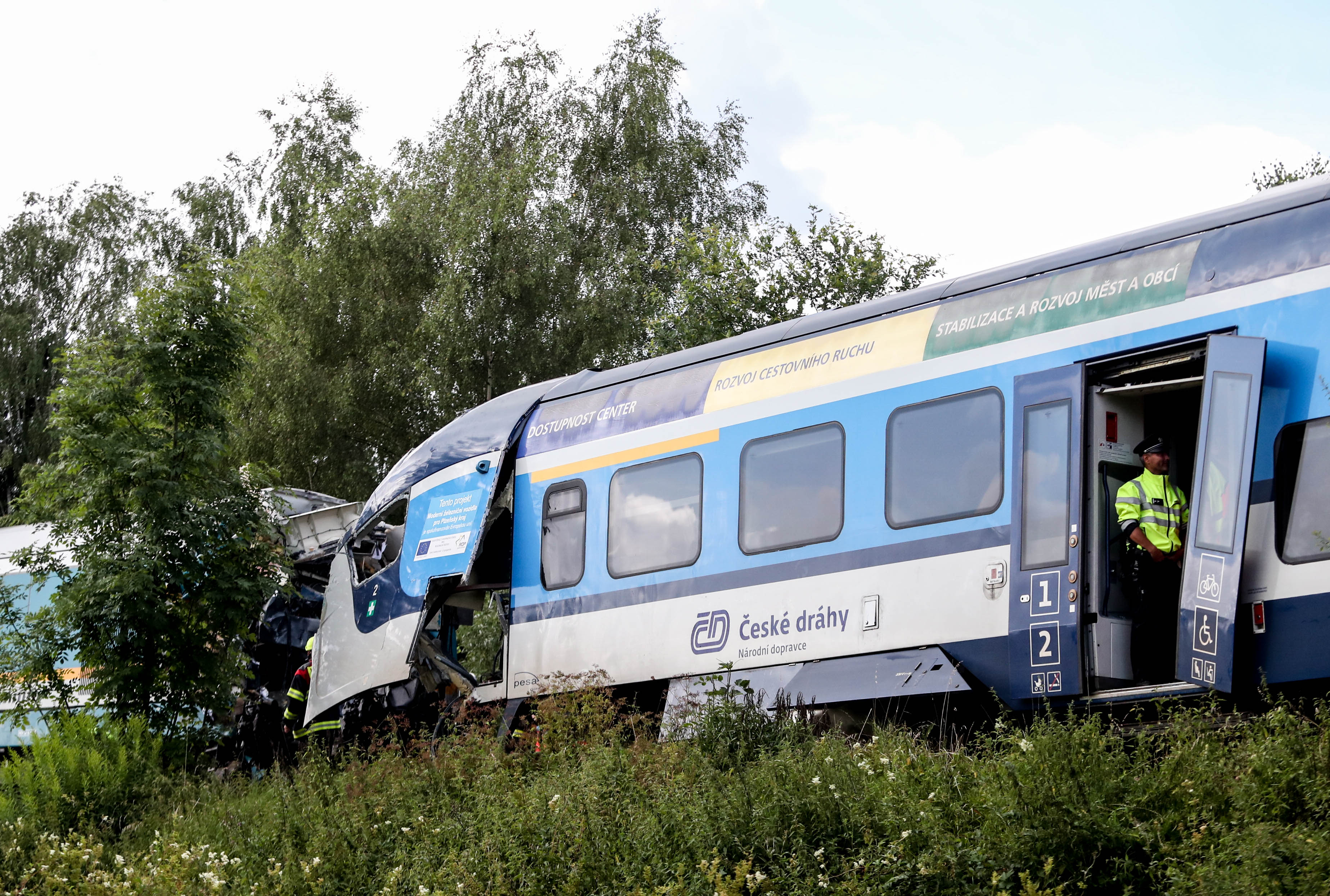 epa09393880 The scene of a train crash near the city of Domazlice, Czech Republic, 04 August 2021. According to official reports, at least two people died and 38 were injured in the collision of two trains.  EPA-EFE/MARTIN DIVISEK