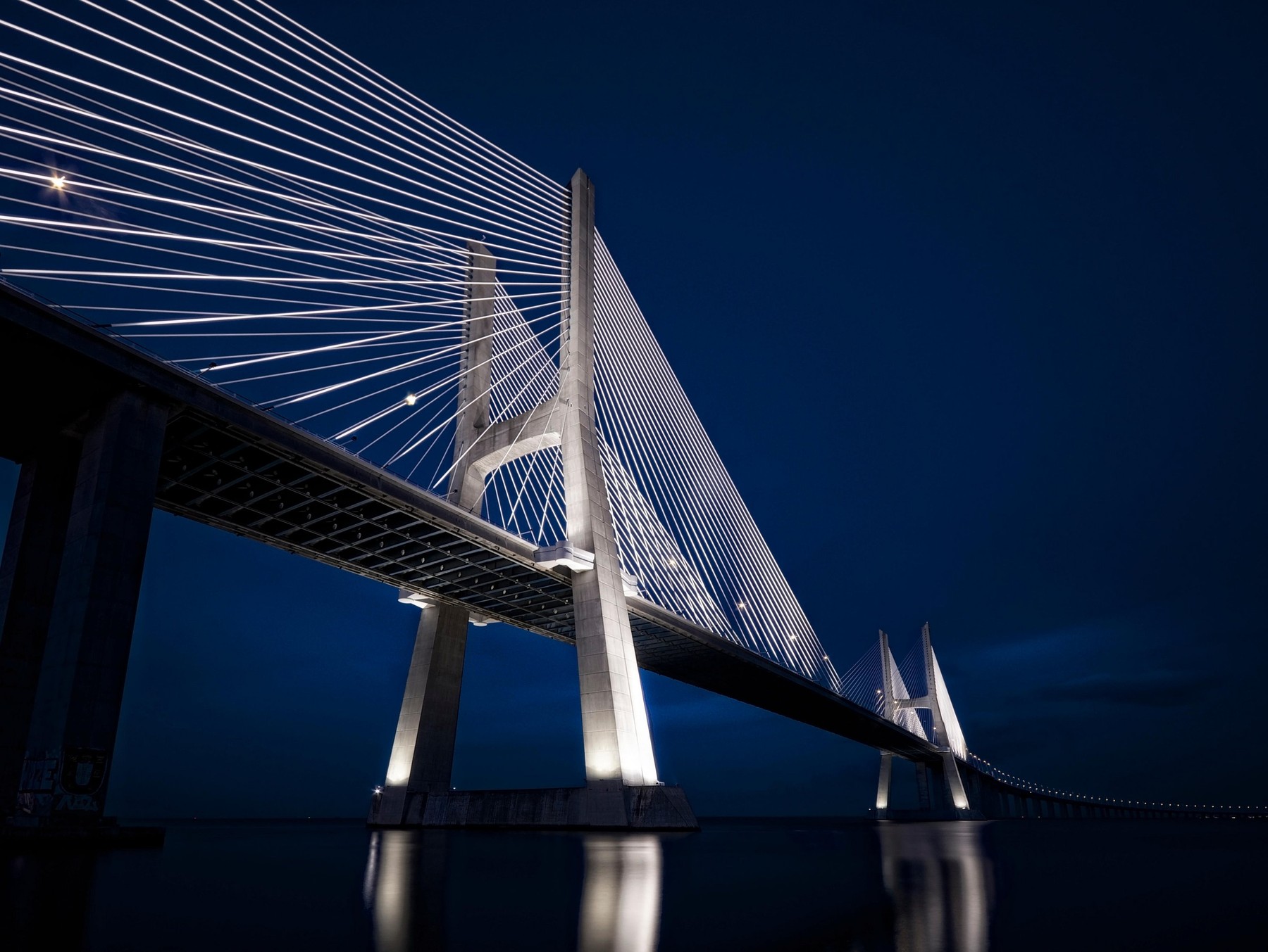 Ponte Vasco da Gama - Vasco da Gama bridge illuminated at ight, Lisbon Portugal
