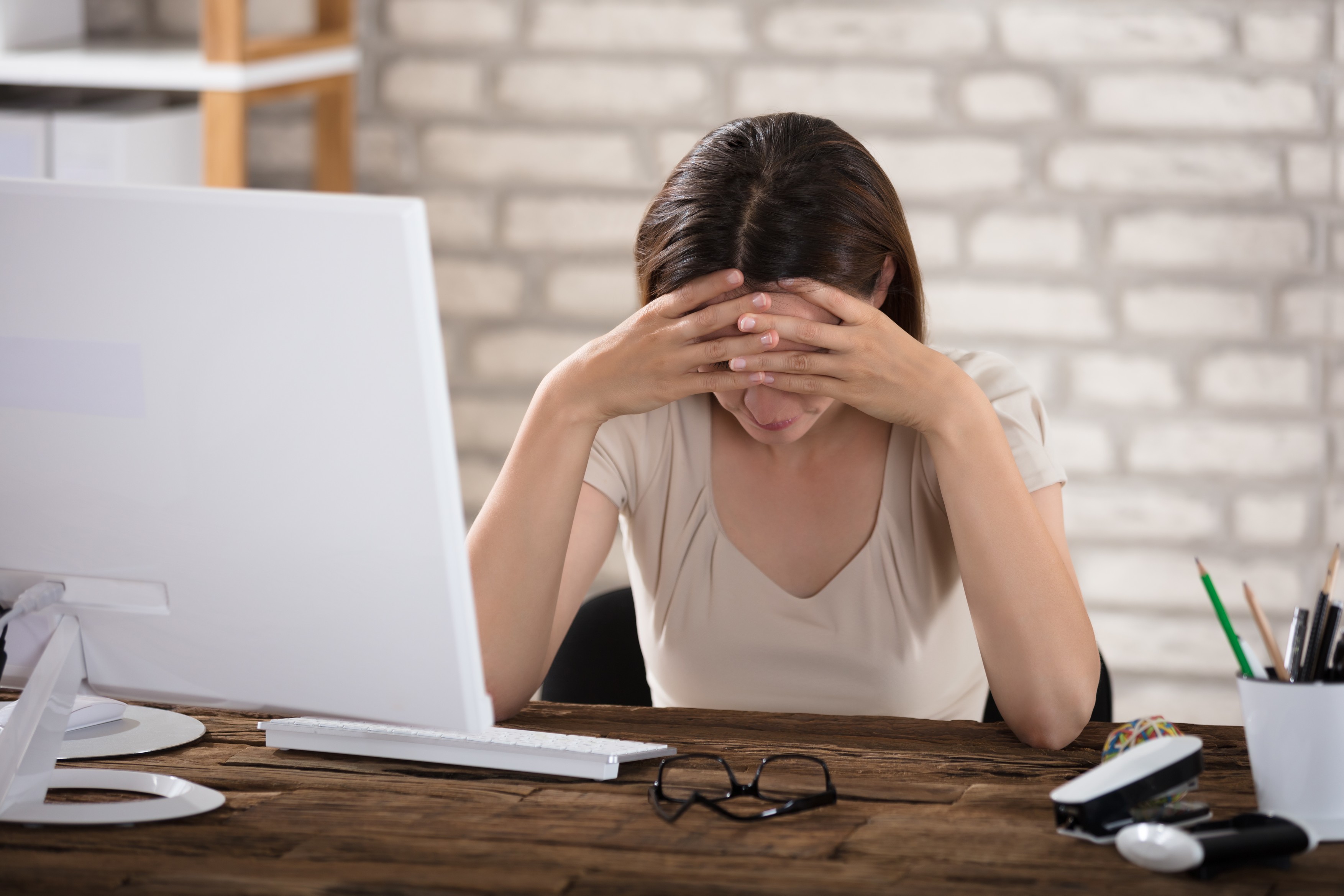 Businesswoman Suffering From Migraine Touching Her Forehead,Image: 347528373, License: Royalty-free, Restrictions: , Model Release: yes, Credit line: Andriy Popov / Panthermedia / Profimedia