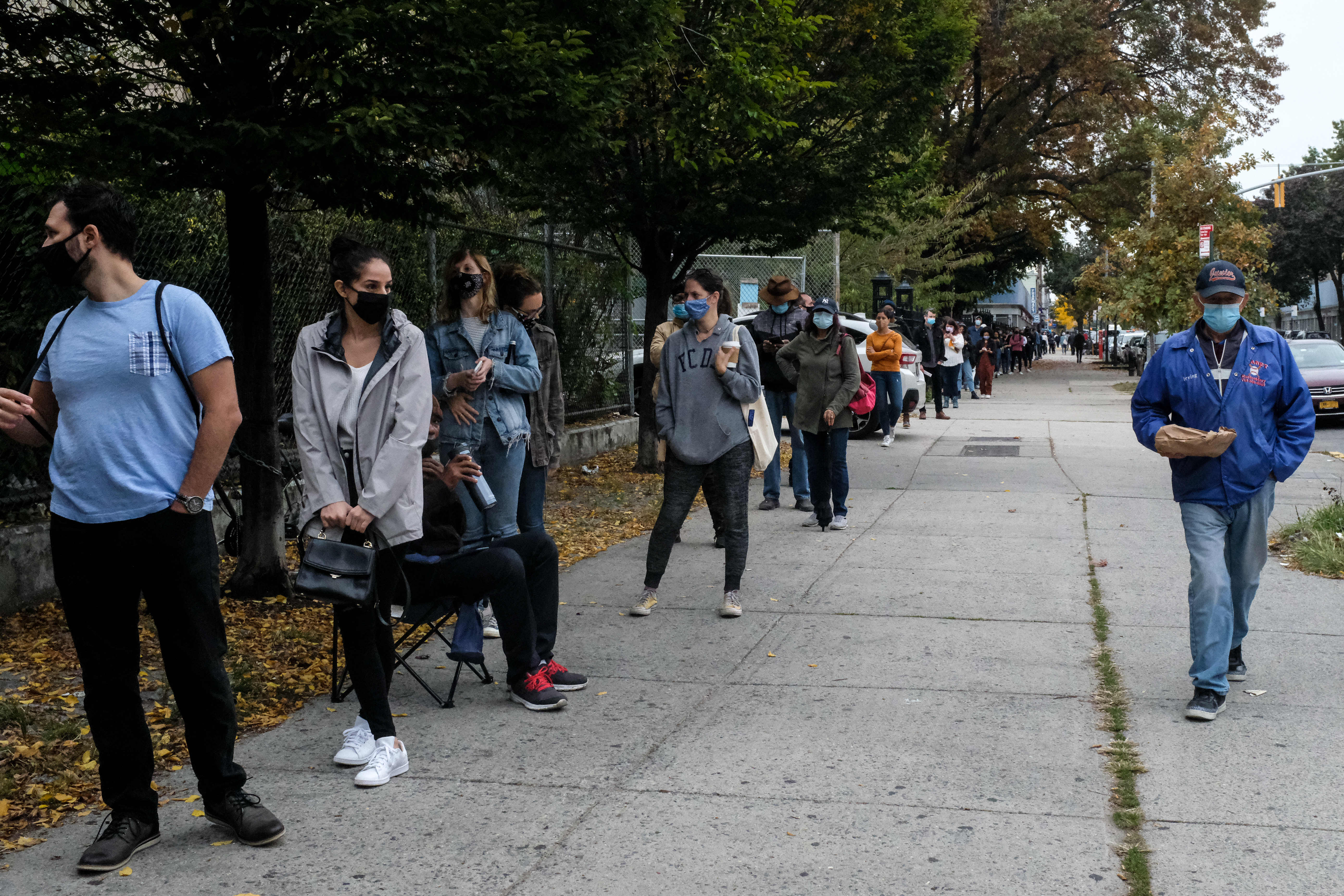 People queue for early voting