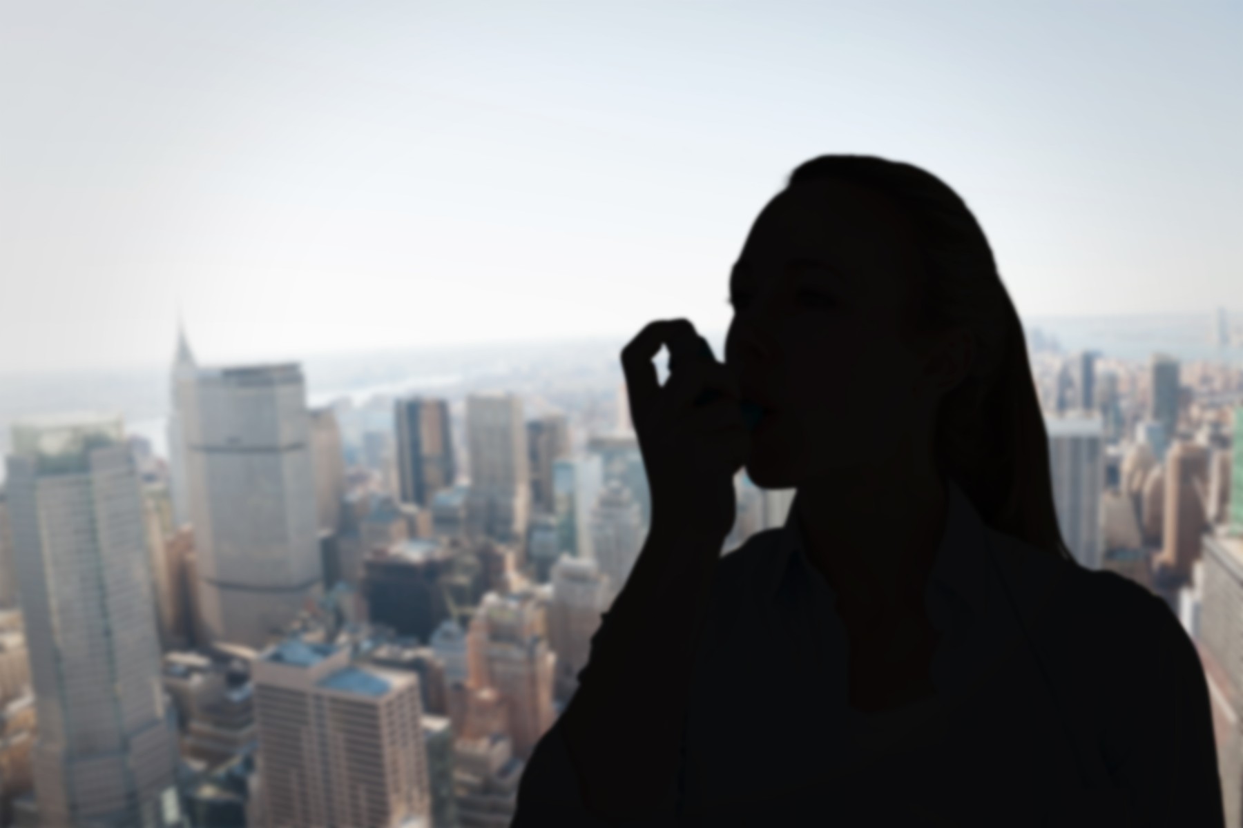 Composite image of pretty blonde using an asthma inhaler