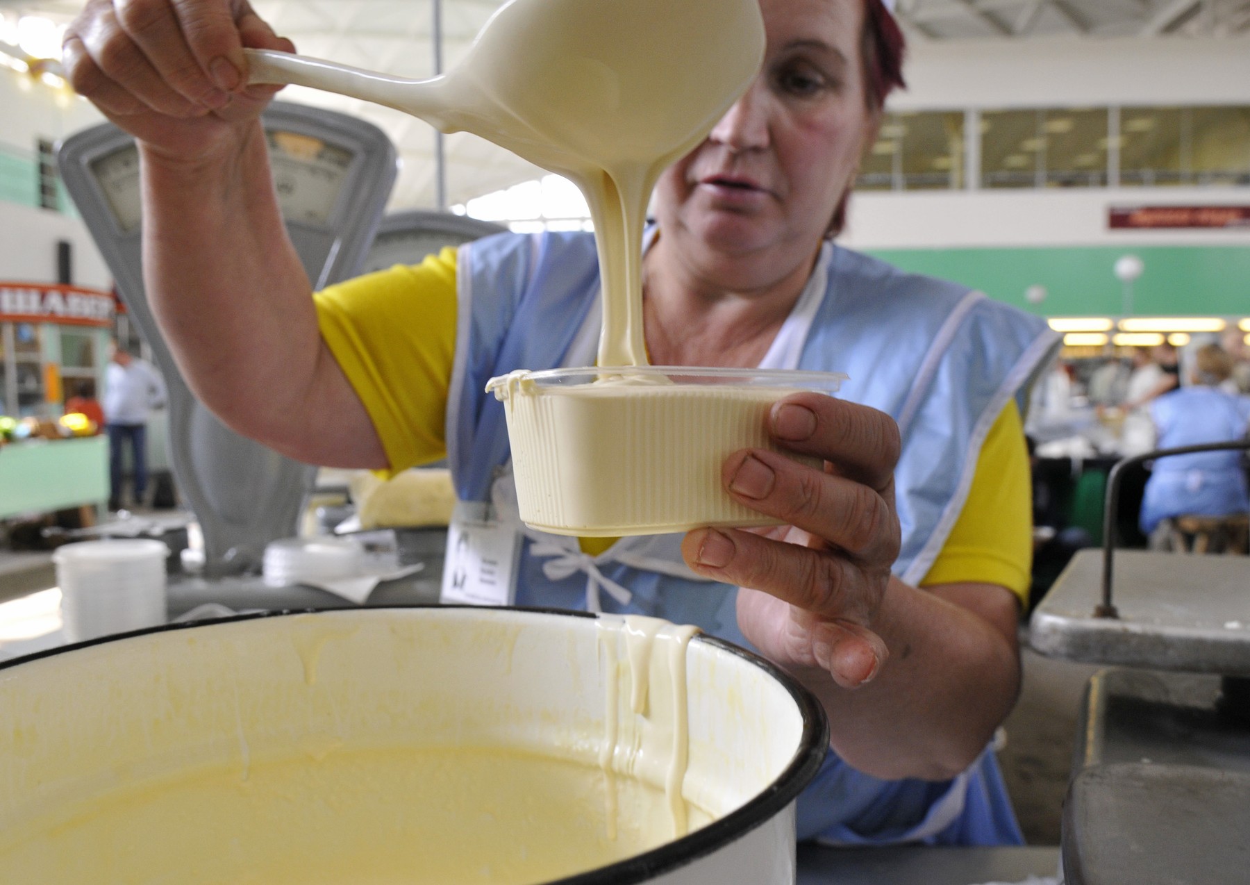 08: NOVGOROD REGION, RUSSIA. AUGUST 29. A woman sells sour cream at a food market.,Image: 26892538, License: Rights-managed, Restrictions: , Model Release: no, Credit line: Mordasov Mikhail / TASS / Profimedia