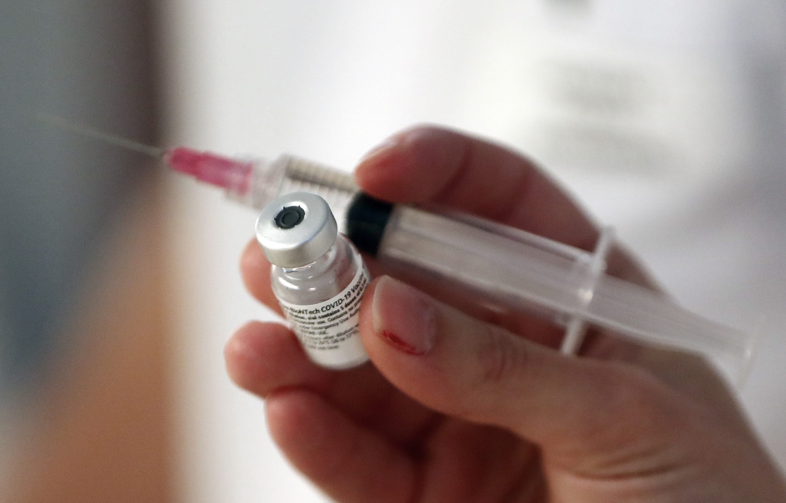 epa08919052 A nurse prepares a dose of the Pfizer-BioNTech COVID-19 vaccine at Antoine Balmes hospital in Montpellier, France, 04 January 2021. France on 27 December 2020 began its nationwide Covid-19 vaccination campaign.  EPA-EFE/Guillaume Horcajuelo