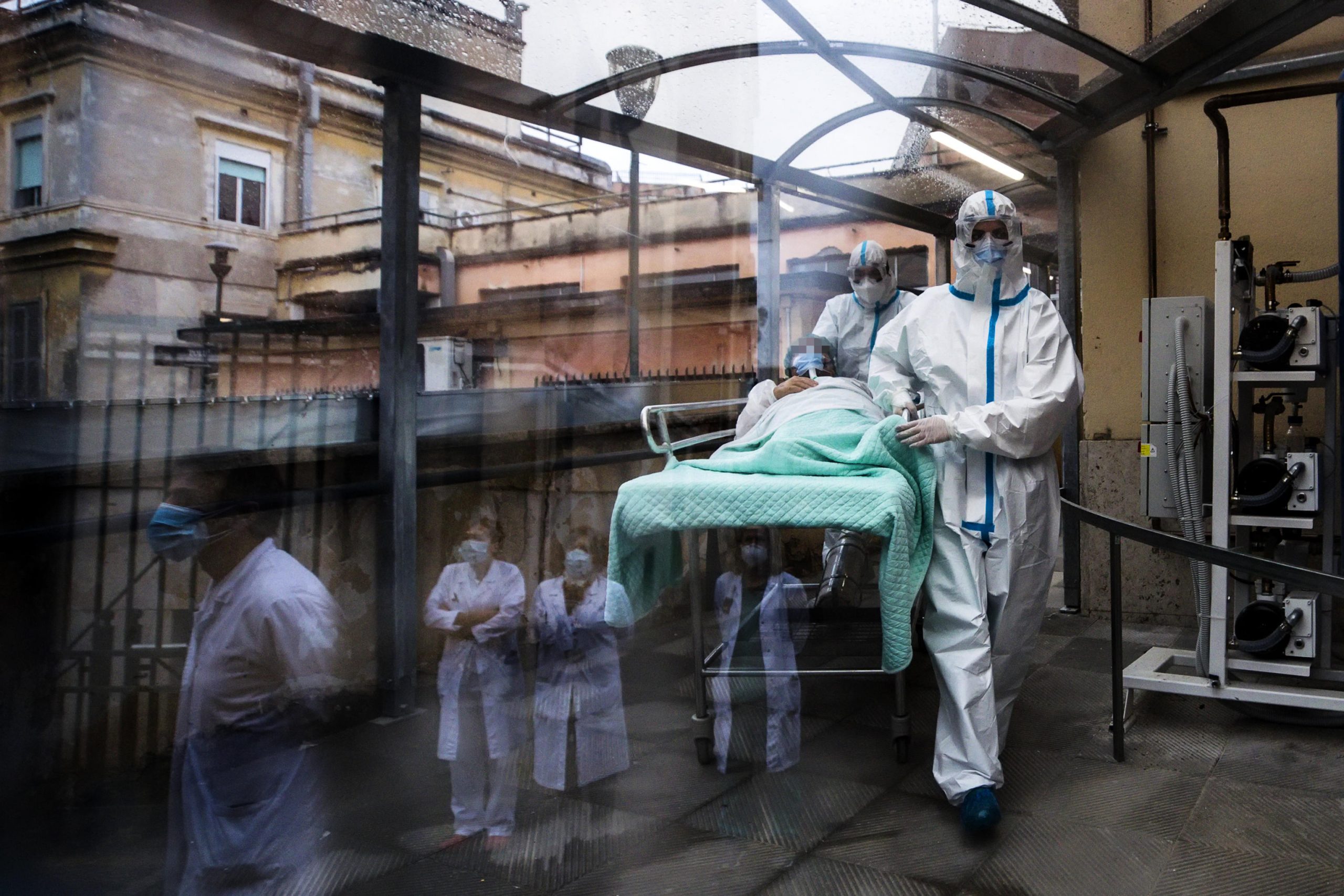 epa08856838 A patient is accompanied to carry out medical examinations at the Covid Emergency Department of the Umberto I Hospital in Rome, Italy, 02 December 2020.  EPA-EFE/ANGELO CARCONI