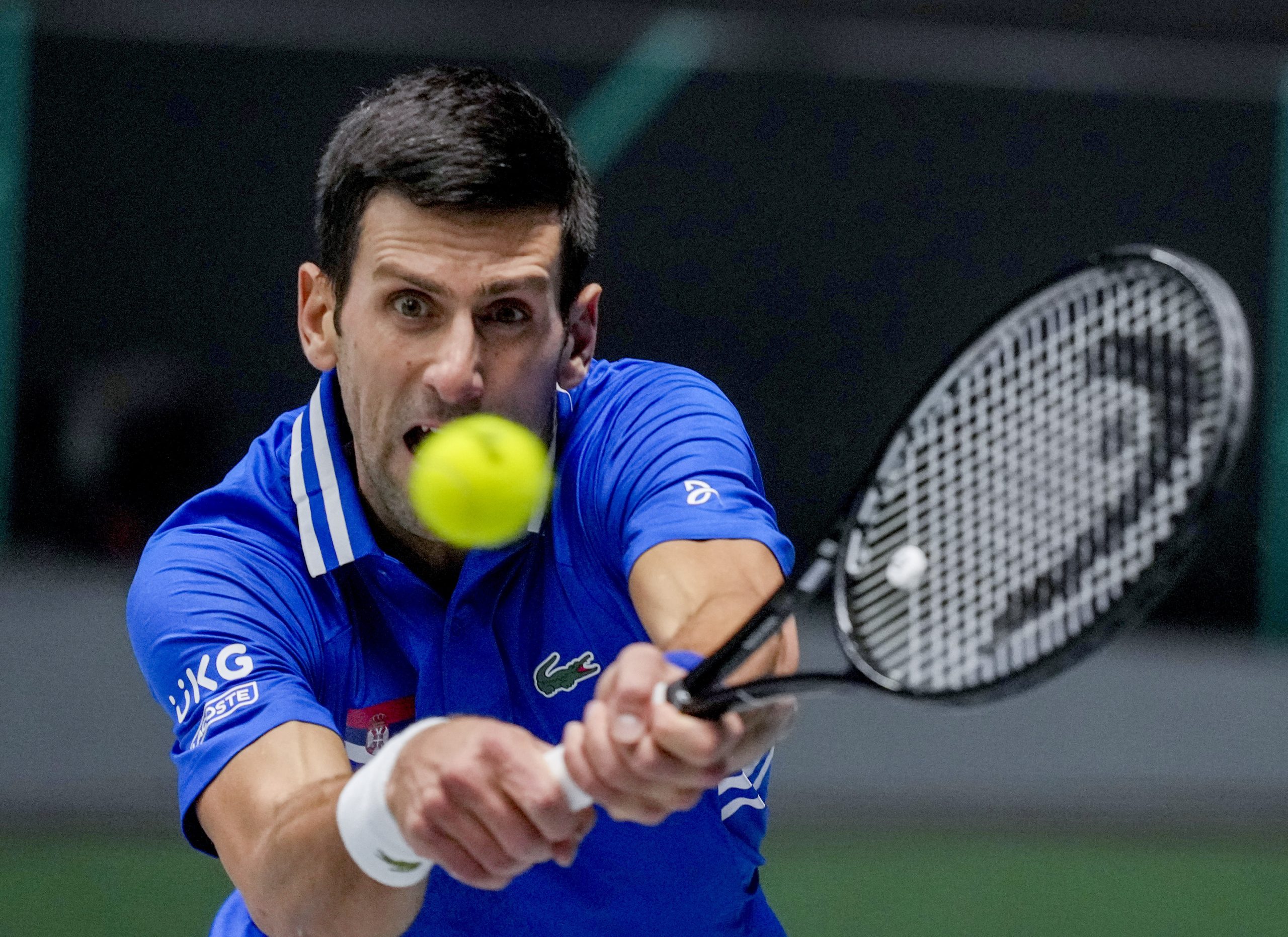 Serbia's Novak Djokovic hits a backhand against Austria's Dennis Novak during a Davis Cup group F match between Serbia and Austria in Innsbruck, Austria, Friday, Nov. 26, 2021. (Photo/Michael Probst)