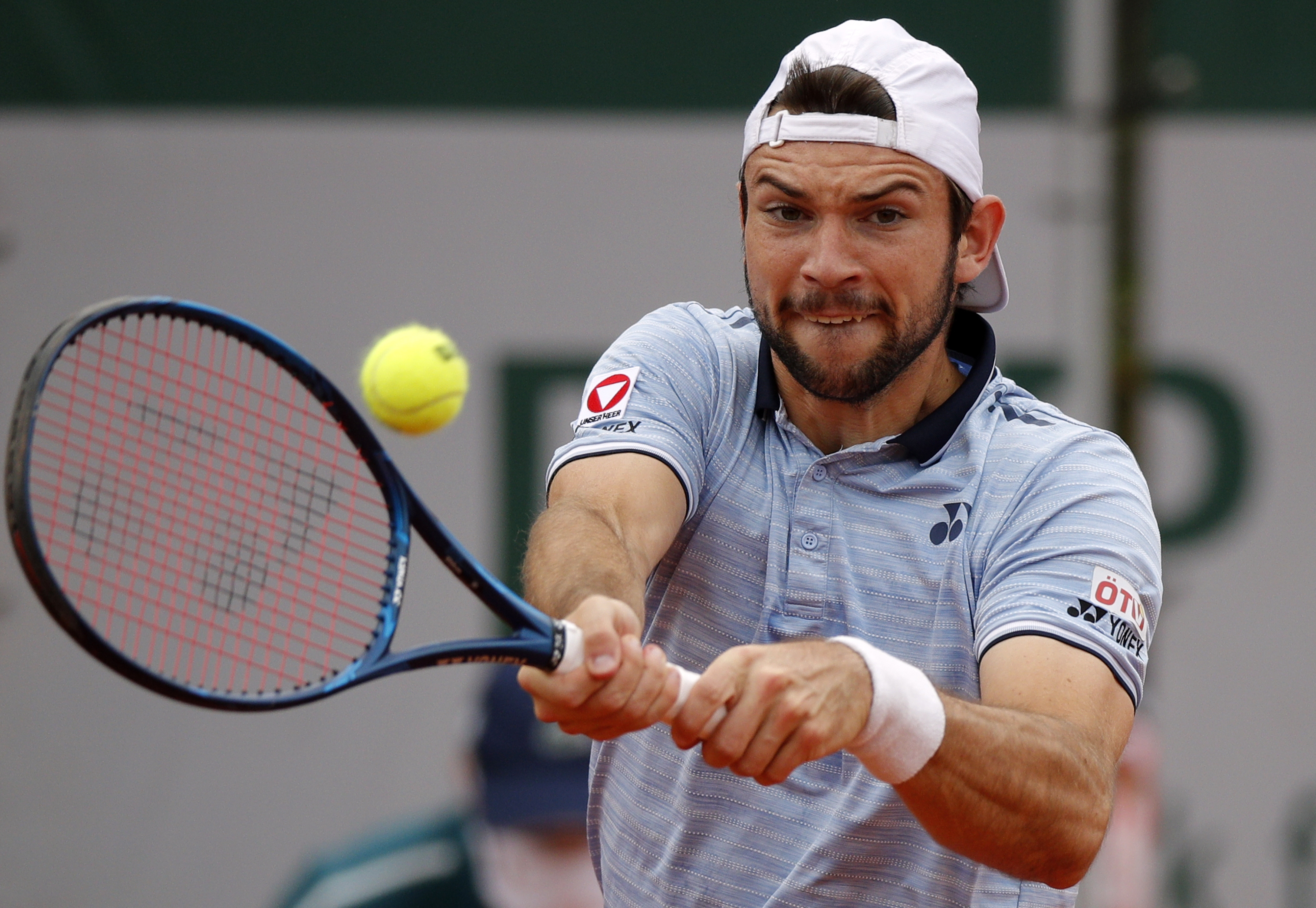 epa08708286 Jurij Rodionov of Austria in action against Norbert Gombos of Slovakia during their men?s second round match during the French Open tennis tournament at Roland ?Garros in Paris, France, 30 September 2020.  EPA-EFE/YOAN VALAT
